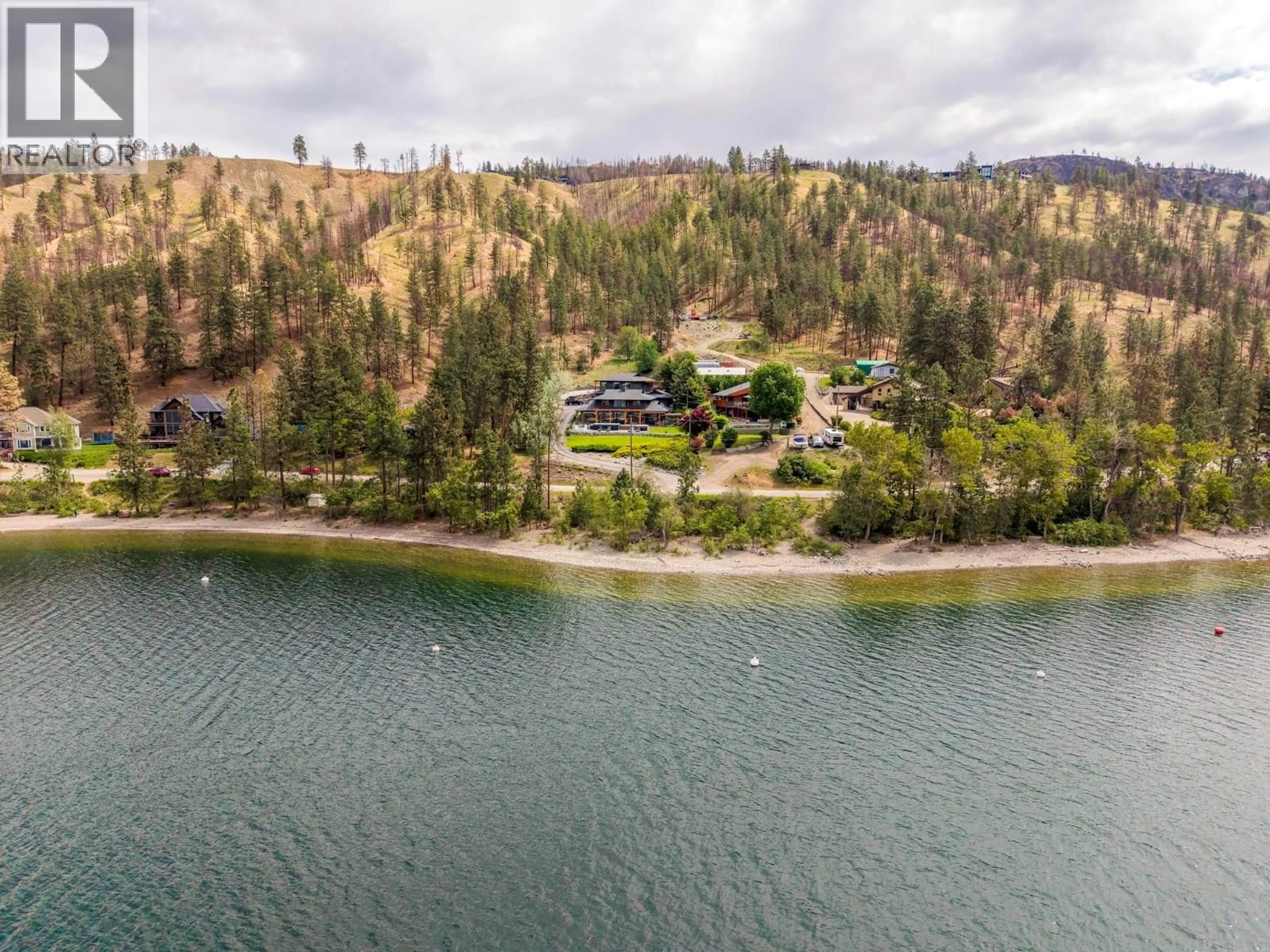 A pic from outside/outdoor area/front of a property/back of a property/a pic from drone, water/lake/river/ocean view for 9887 OKANAGAN CENTRE ROAD WEST, Lake Country British Columbia V4V2J3