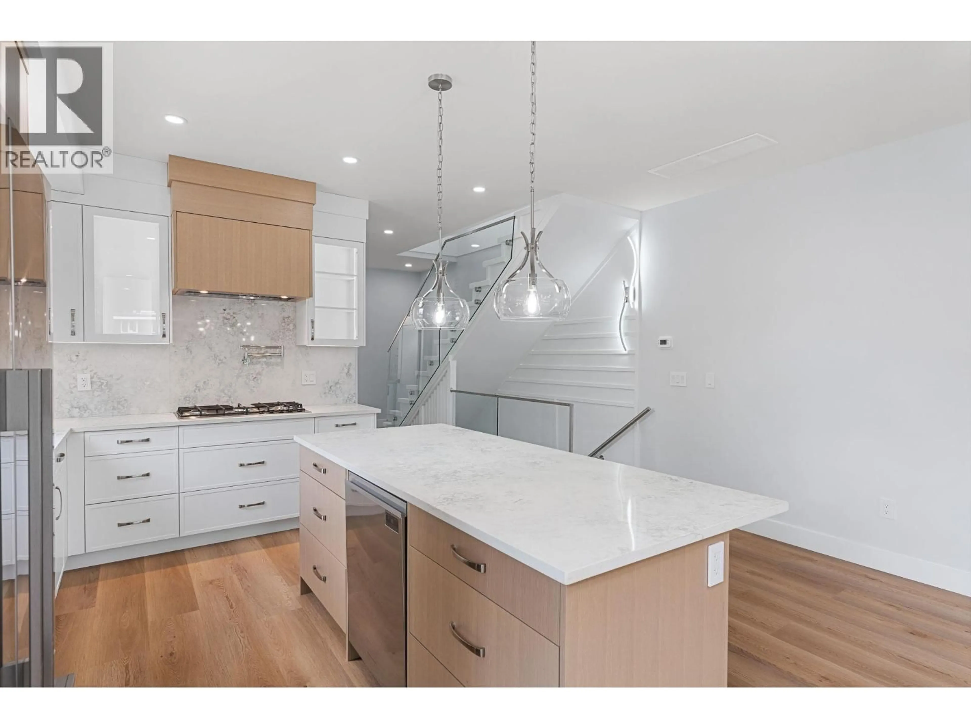 Open concept kitchen, wood/laminate floor for 4567 GORDON DRIVE, Kelowna British Columbia V1W1T3