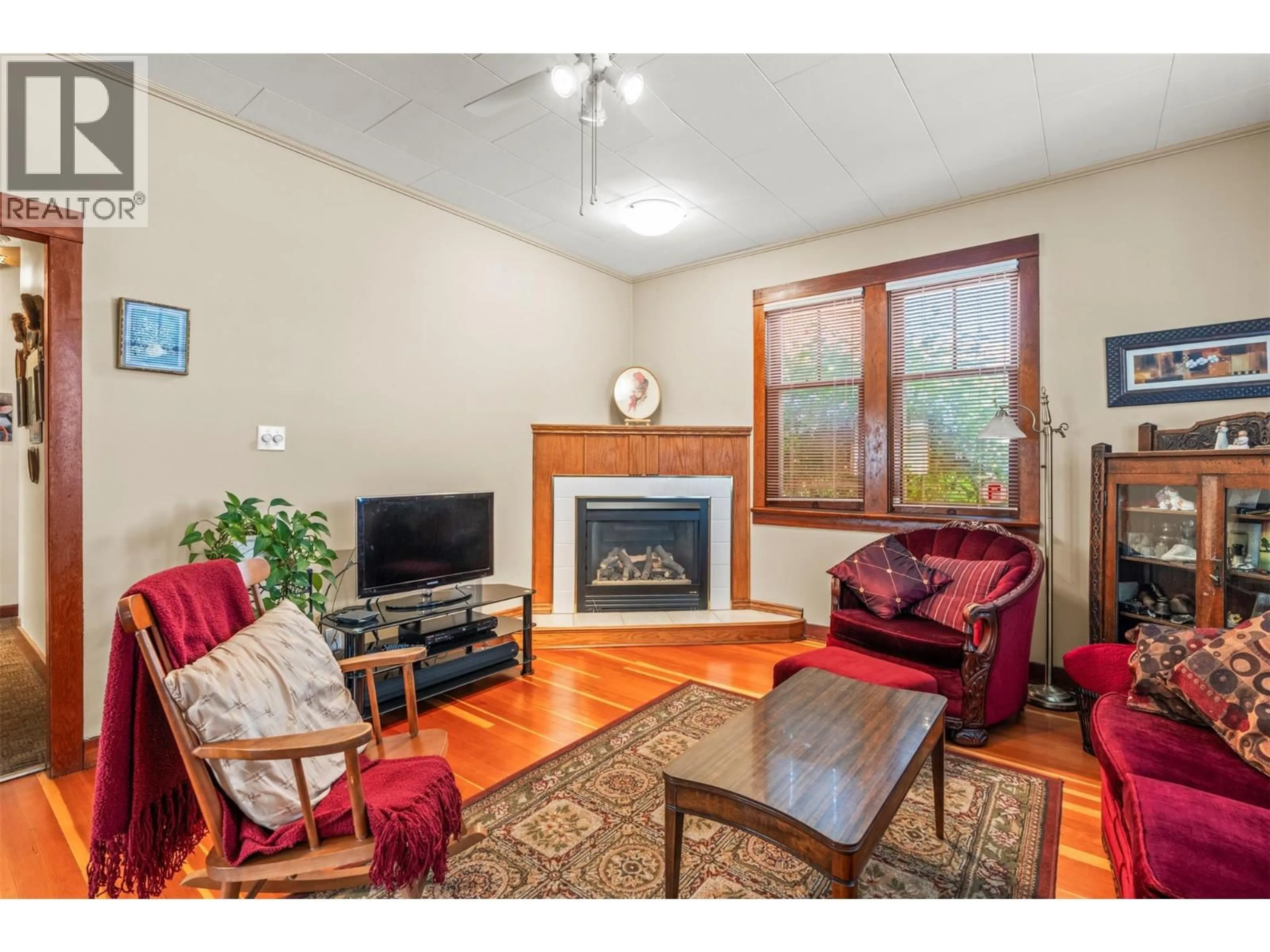 Living room with furniture, wood/laminate floor for 2400 32 AVENUE, Vernon British Columbia V1T2K6