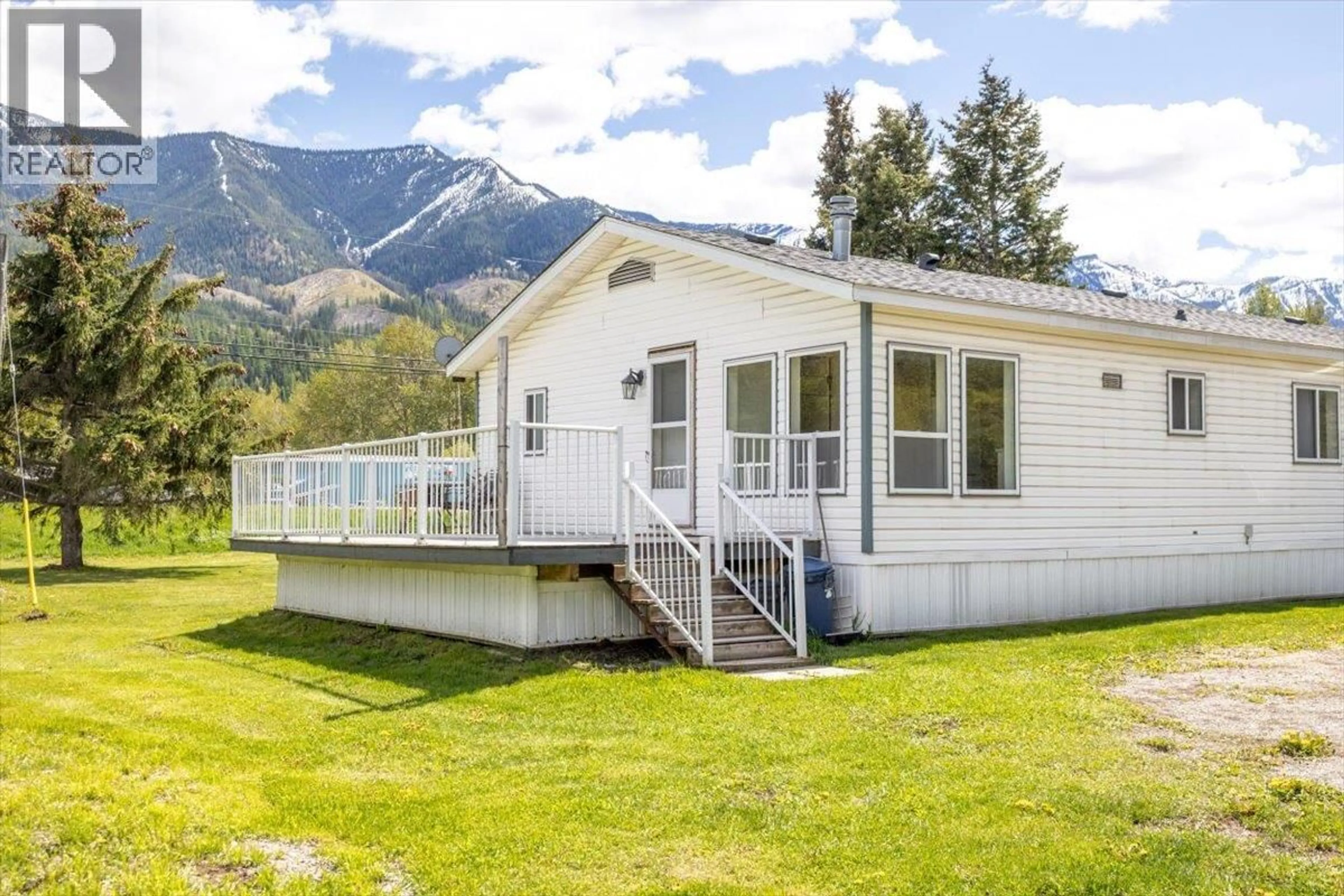 Home with vinyl exterior material, mountain view for 1989 3 HIGHWAY, Fernie British Columbia V0B1M5