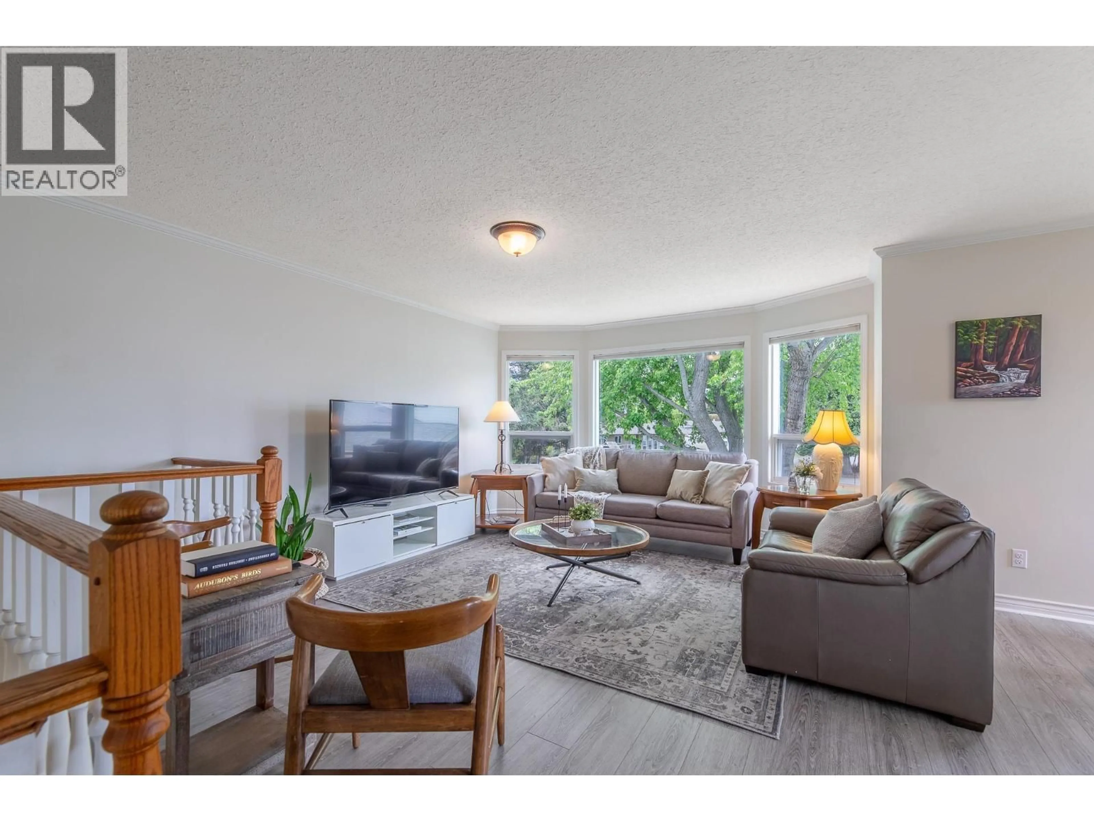 Living room with furniture, wood/laminate floor for 1500 HARDING STREET, Summerland British Columbia V0H1Z9