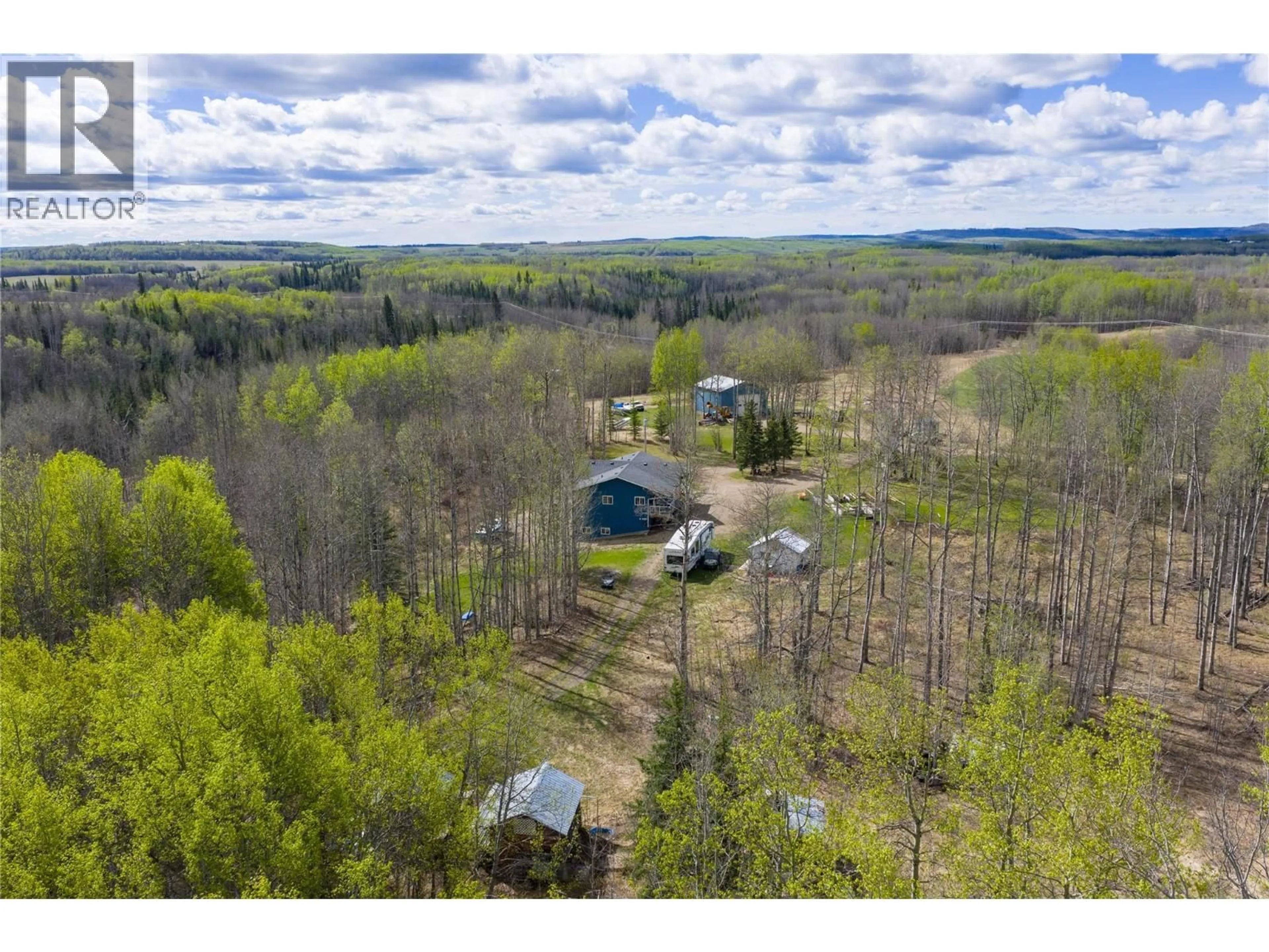 A pic from outside/outdoor area/front of a property/back of a property/a pic from drone, forest/trees view for 5266 WEST ARRAS ROAD, Dawson Creek British Columbia V0C1B0