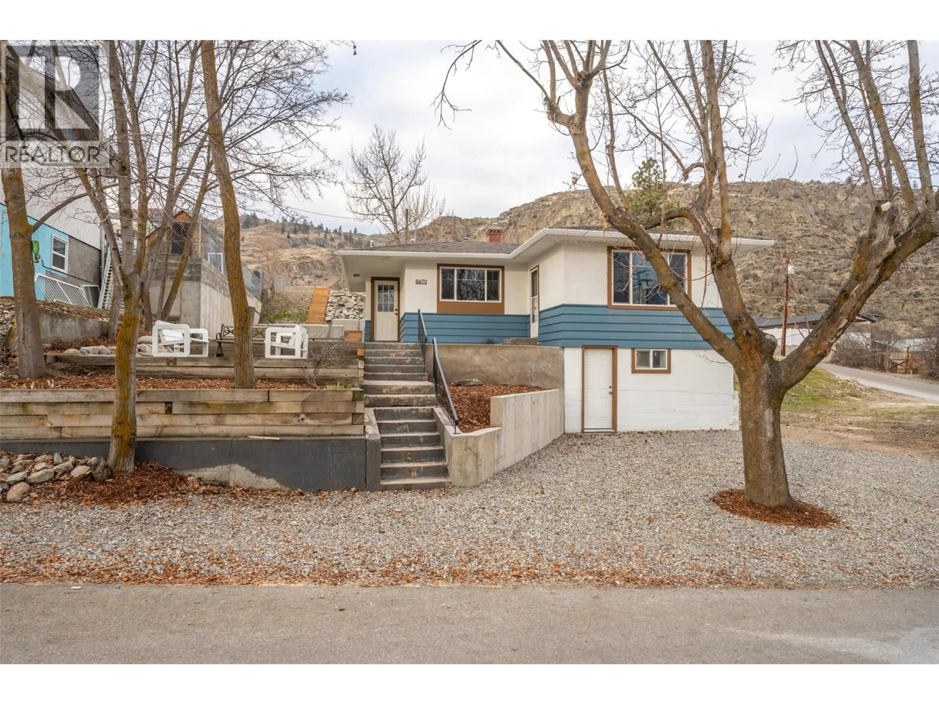 Home with vinyl exterior material, street for 6470 HOLLOW STREET, Oliver British Columbia V0H1T0