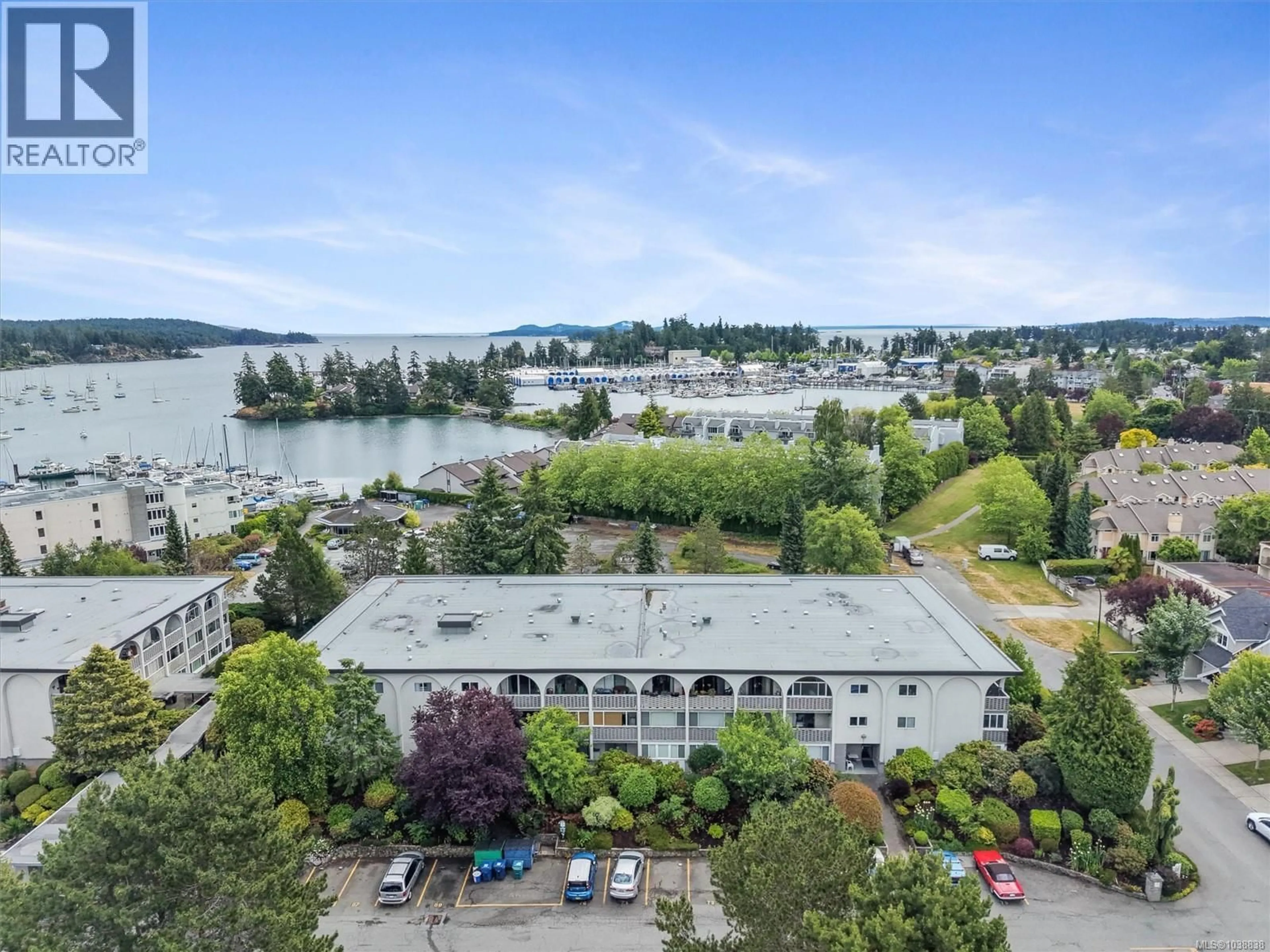 A pic from outside/outdoor area/front of a property/back of a property/a pic from drone, water/lake/river/ocean view for 205 - 2040 WHITE BIRCH ROAD, Sidney British Columbia V8L2R1