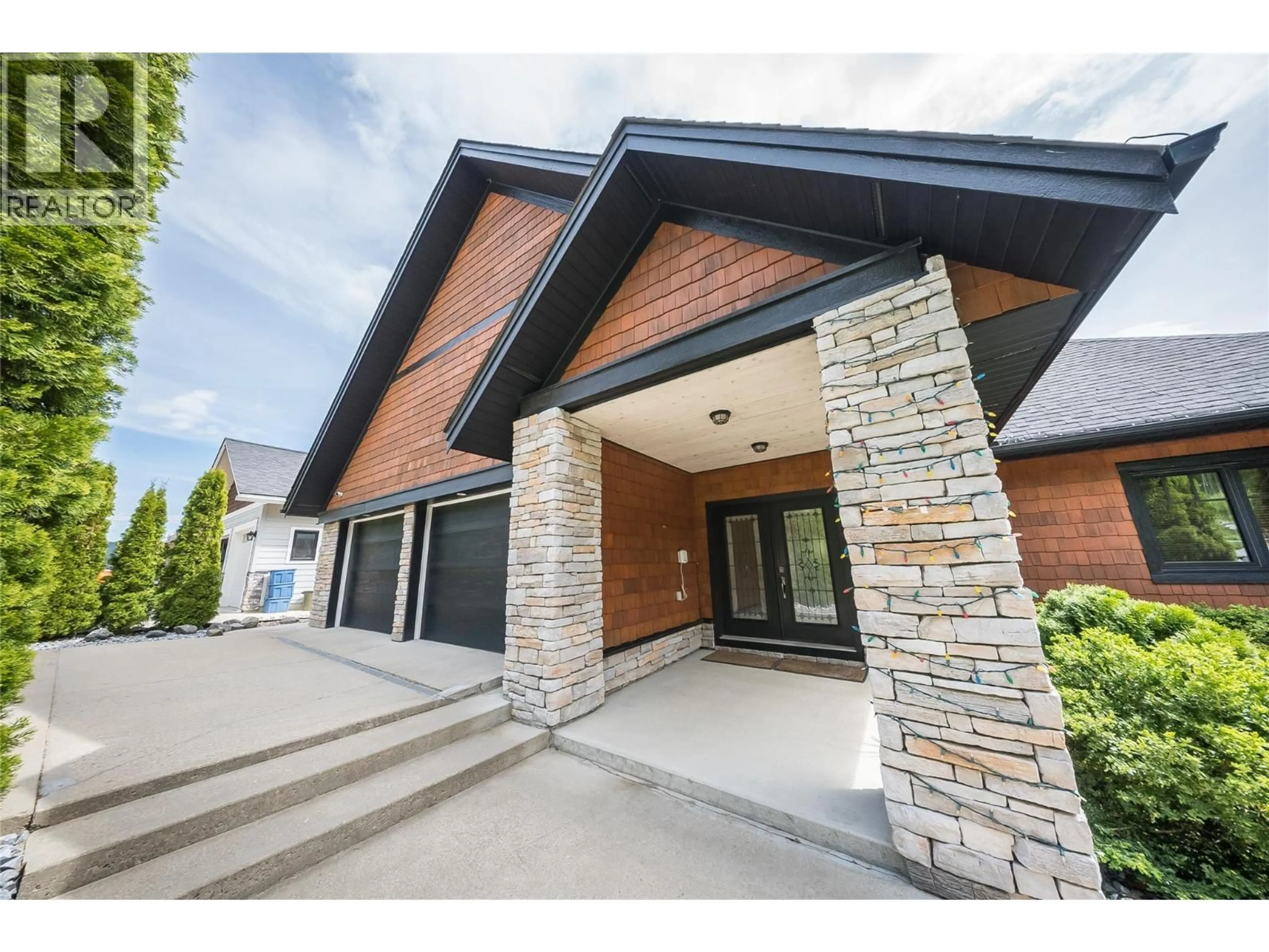 Home with brick exterior material, street for 1009 SILVERTIP ROAD, Rossland British Columbia V0G1Y0