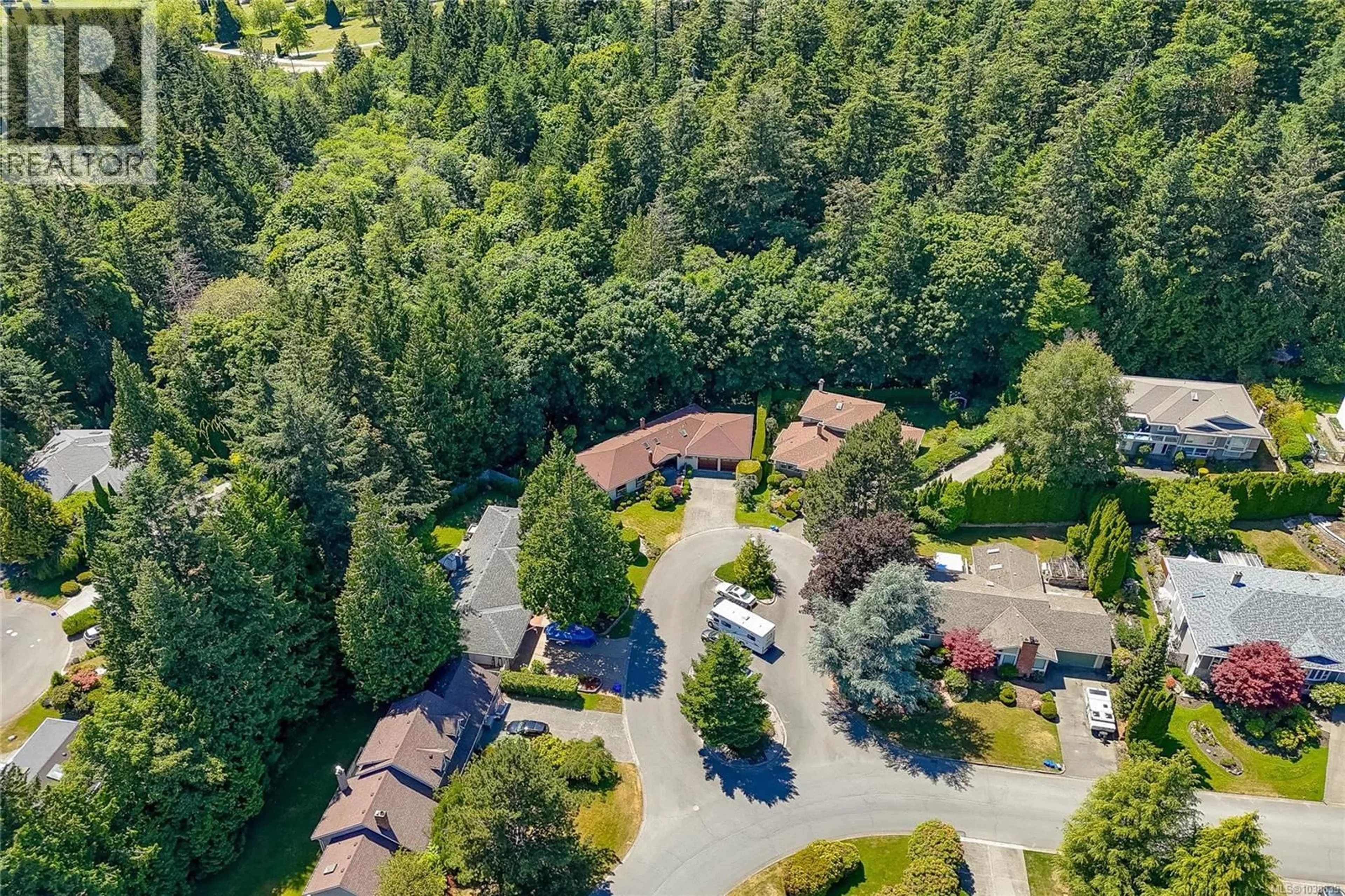 A pic from outside/outdoor area/front of a property/back of a property/a pic from drone, forest/trees view for 4770 AMBLEWOOD DRIVE, Saanich British Columbia V8Y2S3
