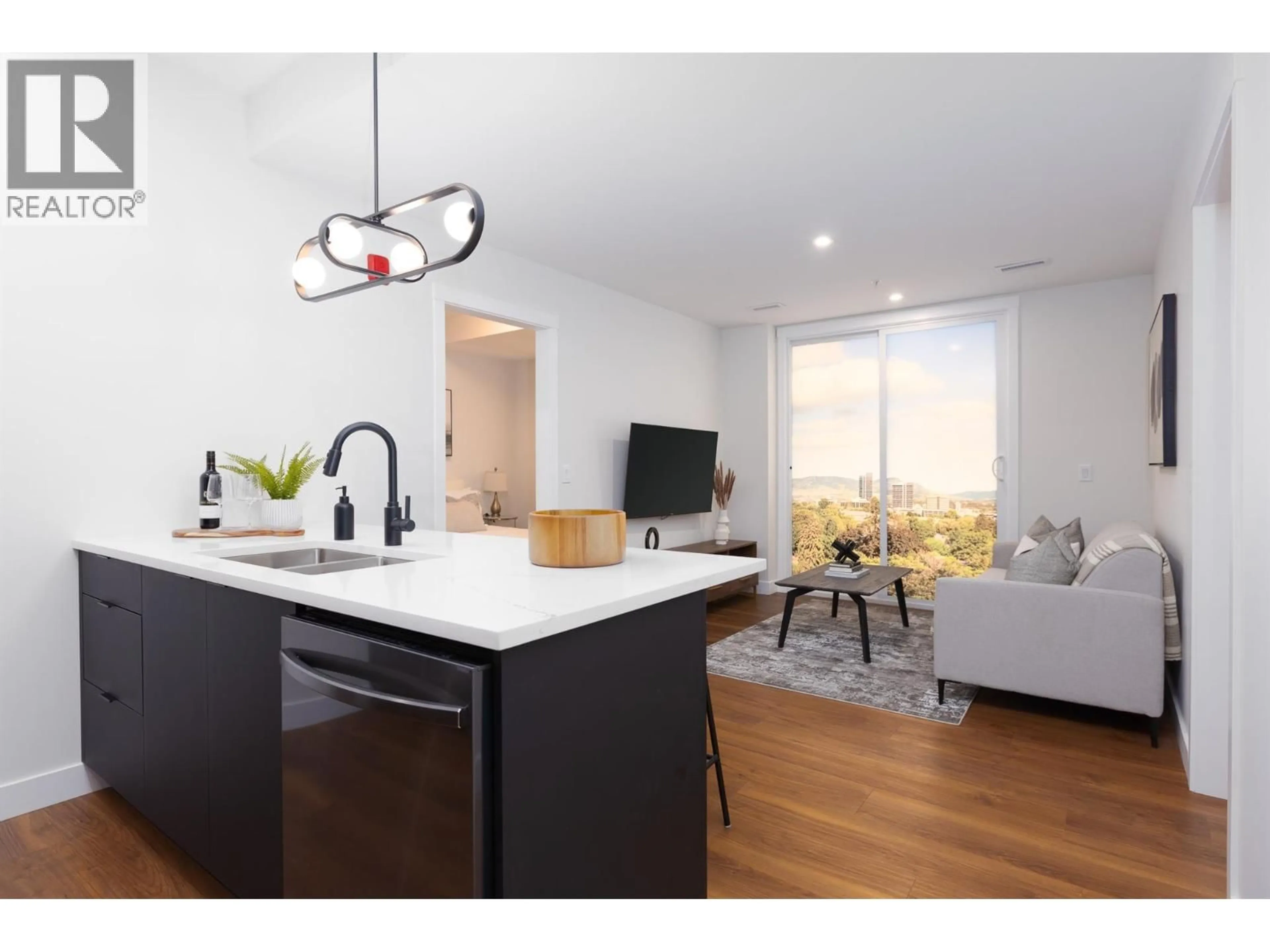 Open concept kitchen, wood/laminate floor for 446 - 1281 PRIDHAM AVENUE, Kelowna British Columbia V1Y6B3