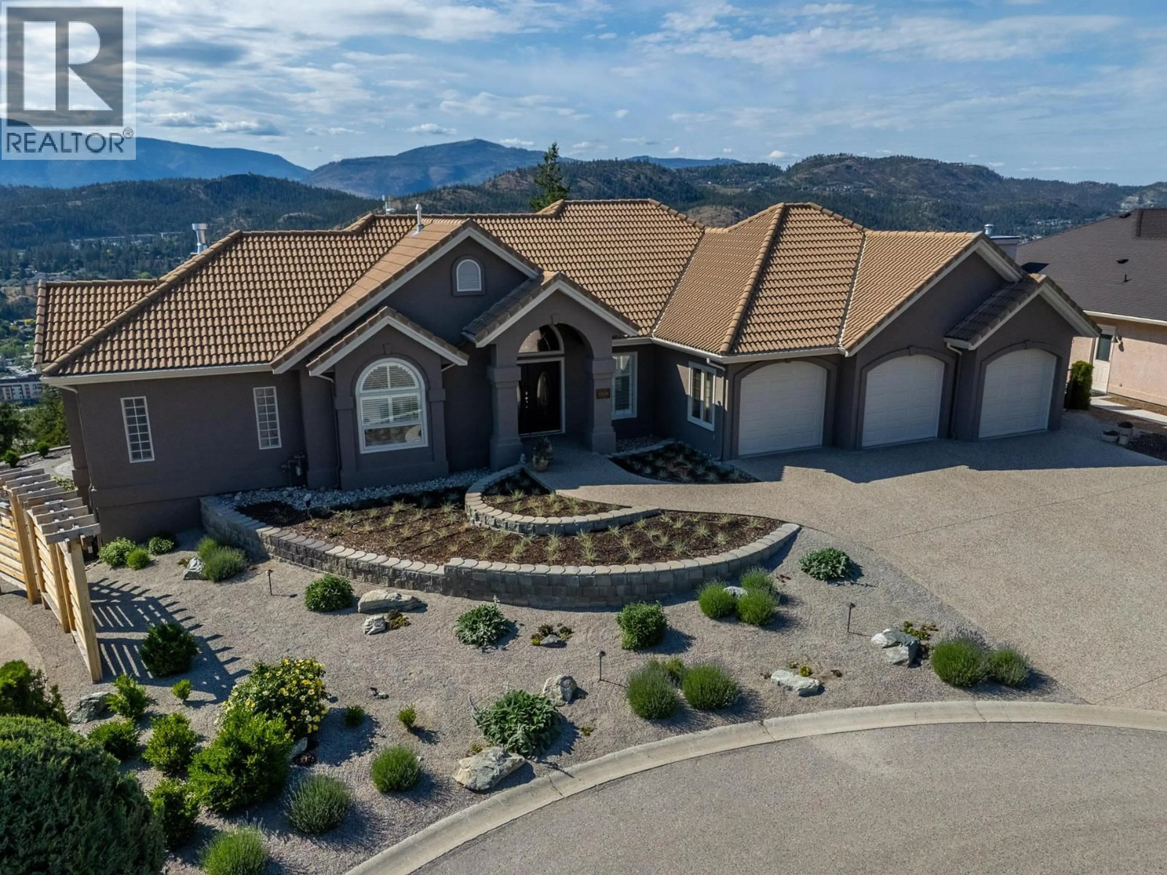A pic from outside/outdoor area/front of a property/back of a property/a pic from drone, mountain view for 2150 BRECKENRIDGE COURT, Kelowna British Columbia V1V1W2