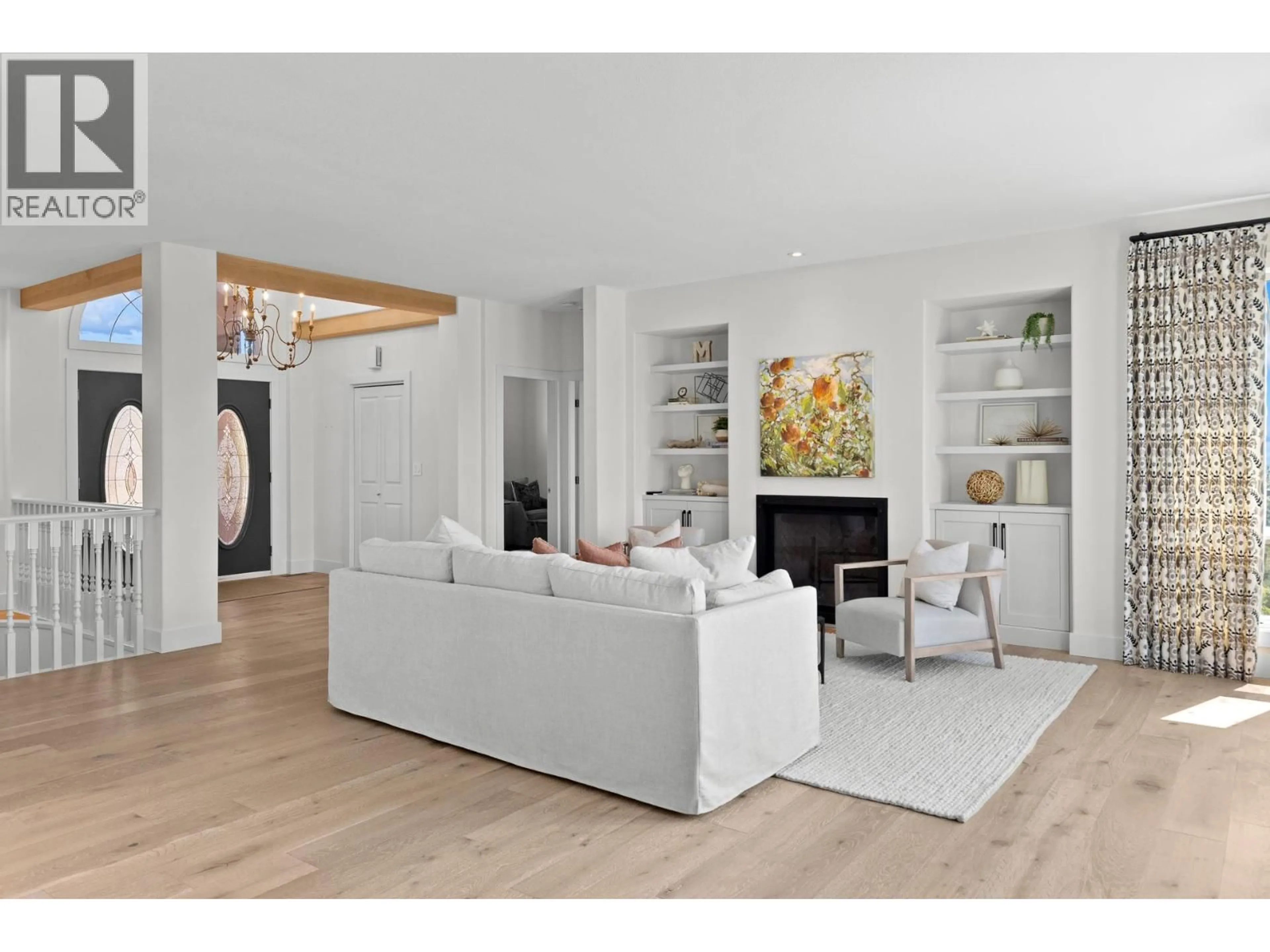 Living room with furniture, wood/laminate floor for 2150 BRECKENRIDGE COURT, Kelowna British Columbia V1V1W2