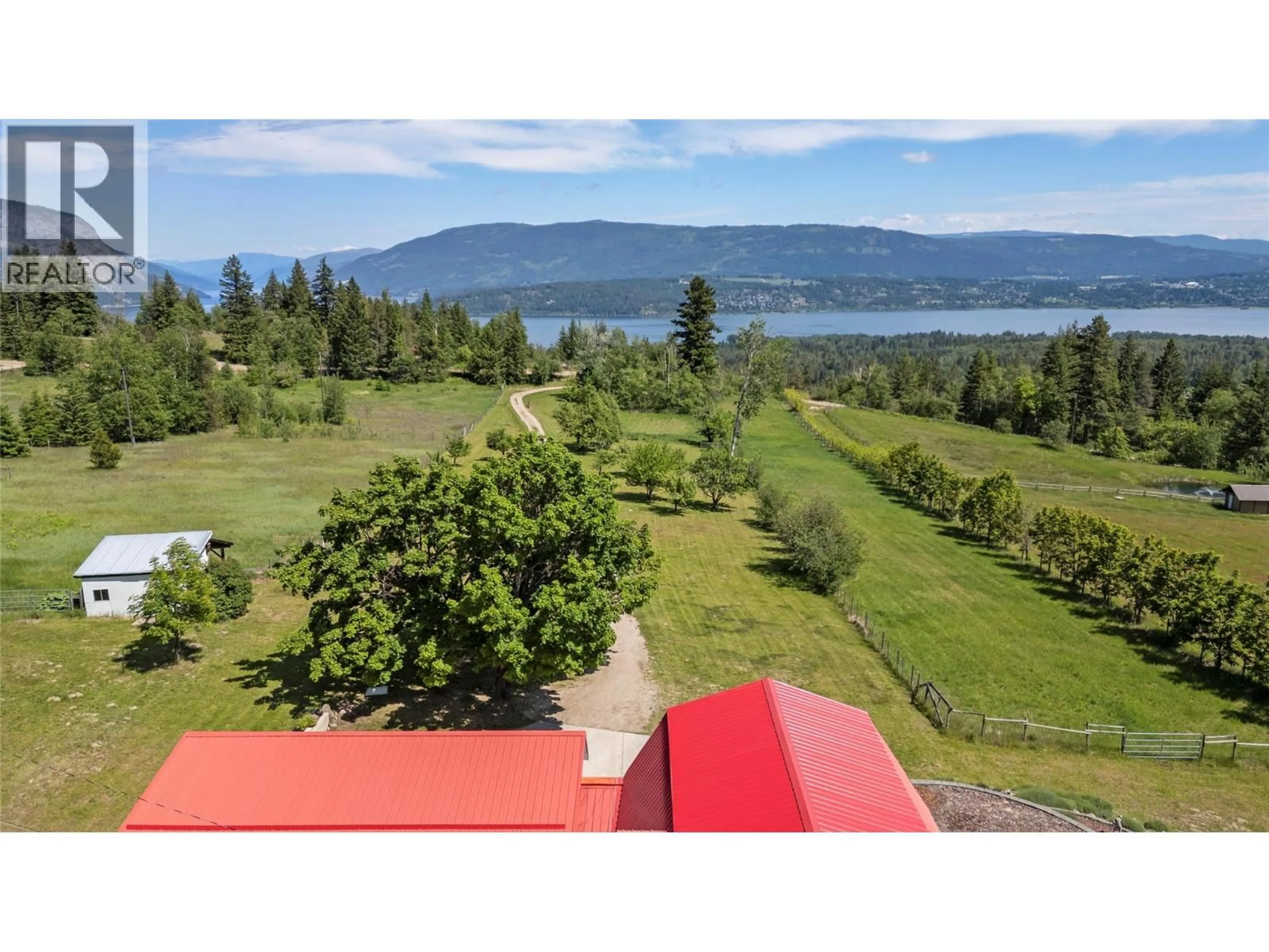 A pic from outside/outdoor area/front of a property/back of a property/a pic from drone, water/lake/river/ocean view for 5641 50 STREET NORTHWEST, Salmon Arm British Columbia V1E3A6