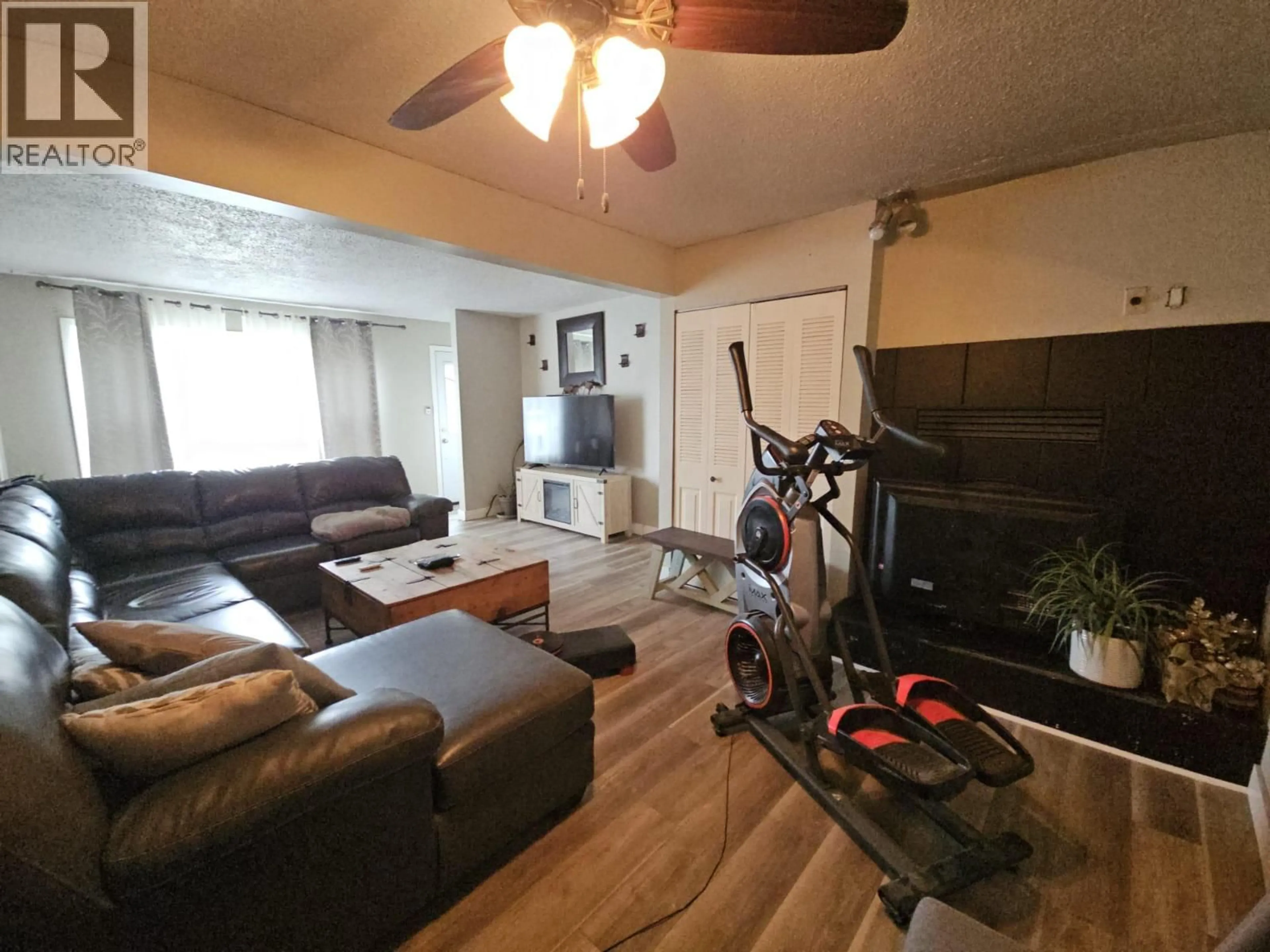 Living room with furniture, unknown for 4704 50 AVENUE NORTHEAST, Chetwynd British Columbia V0C1J0