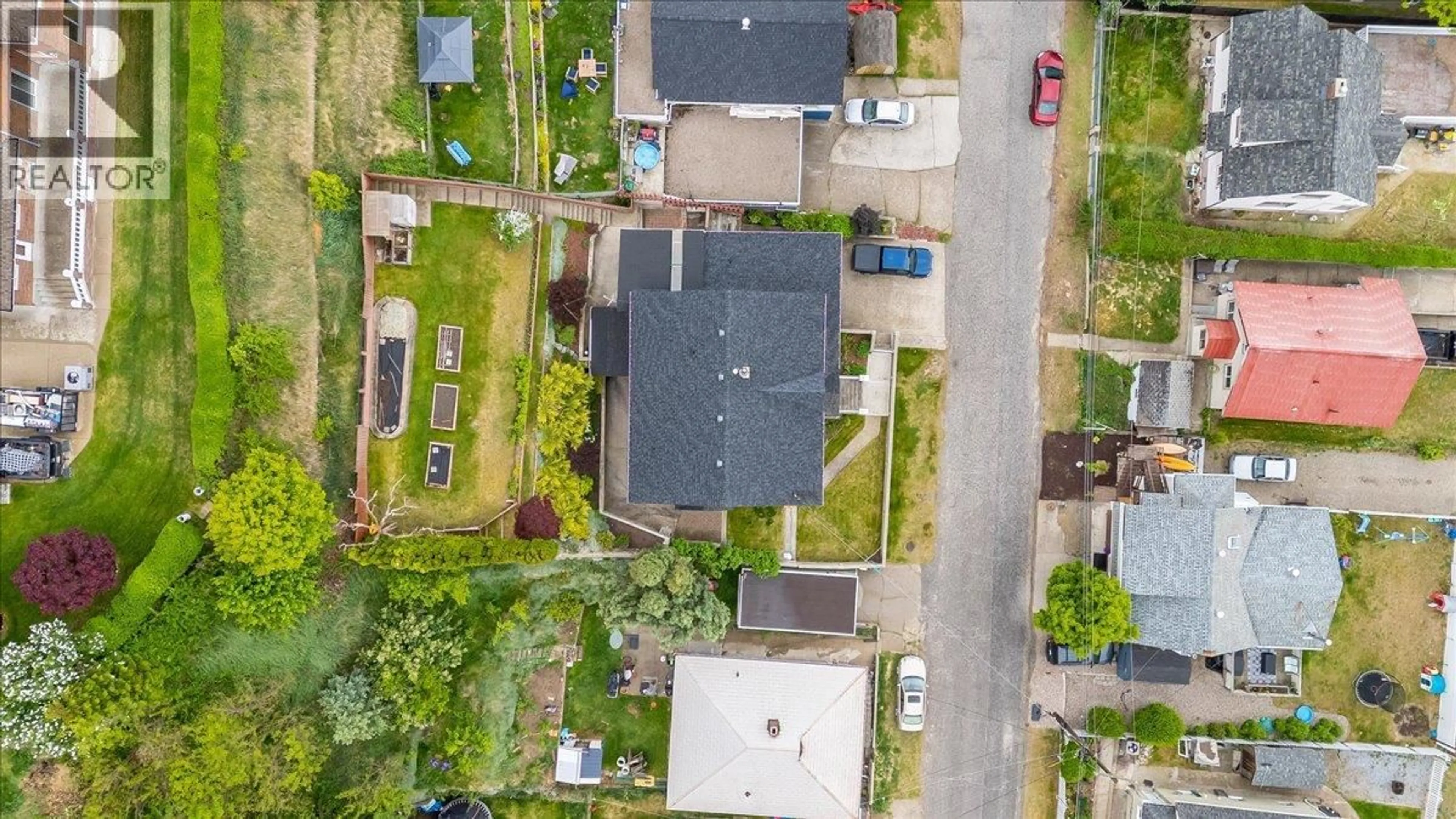 A pic from outside/outdoor area/front of a property/back of a property/a pic from drone, street for 128 COLLEY STREET, Warfield British Columbia V1R2M2
