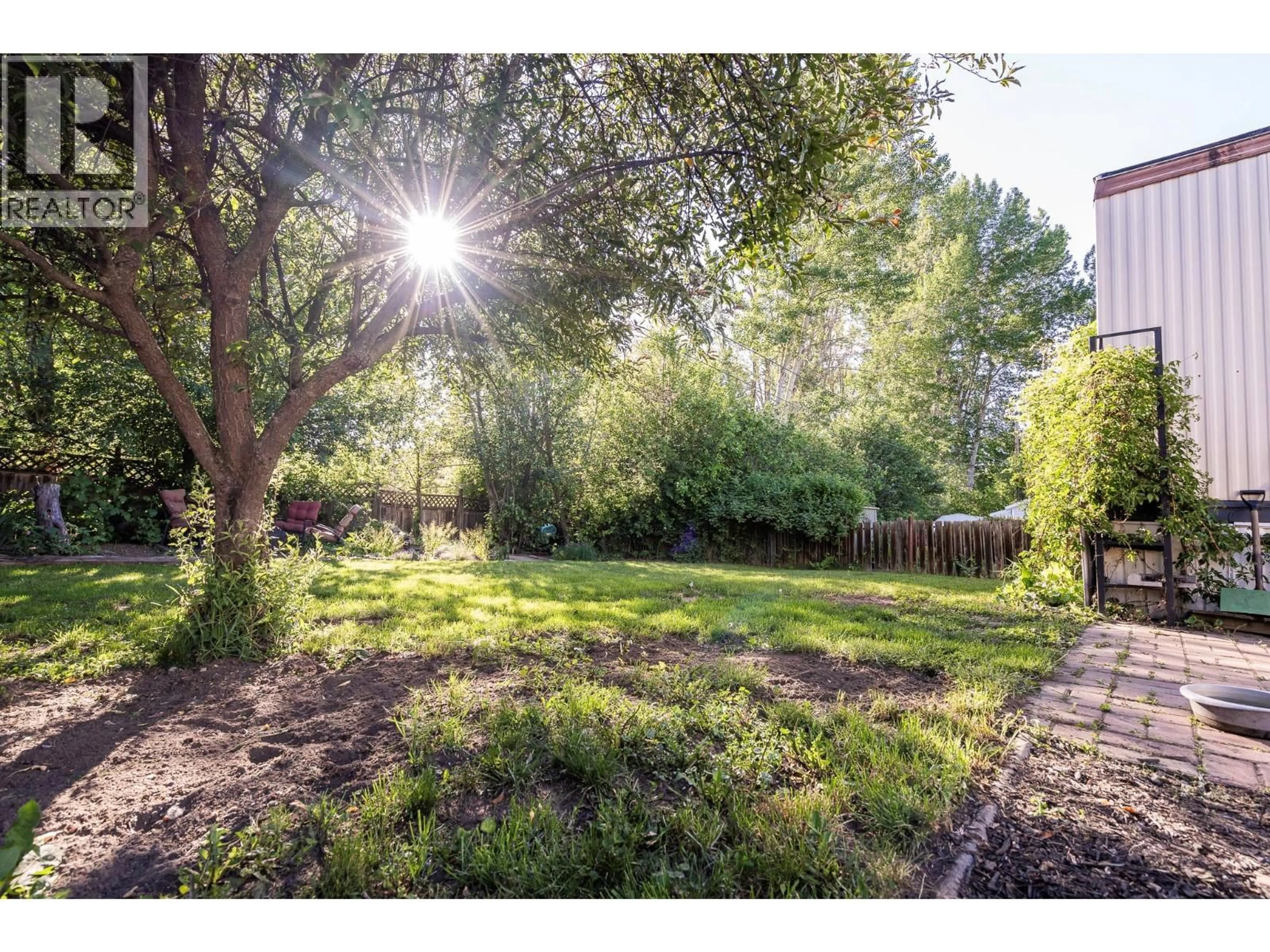 A pic from outside/outdoor area/front of a property/back of a property/a pic from drone, forest/trees view for 8 - 720 COMMONWEALTH ROAD, Lake Country British Columbia V4V1R5