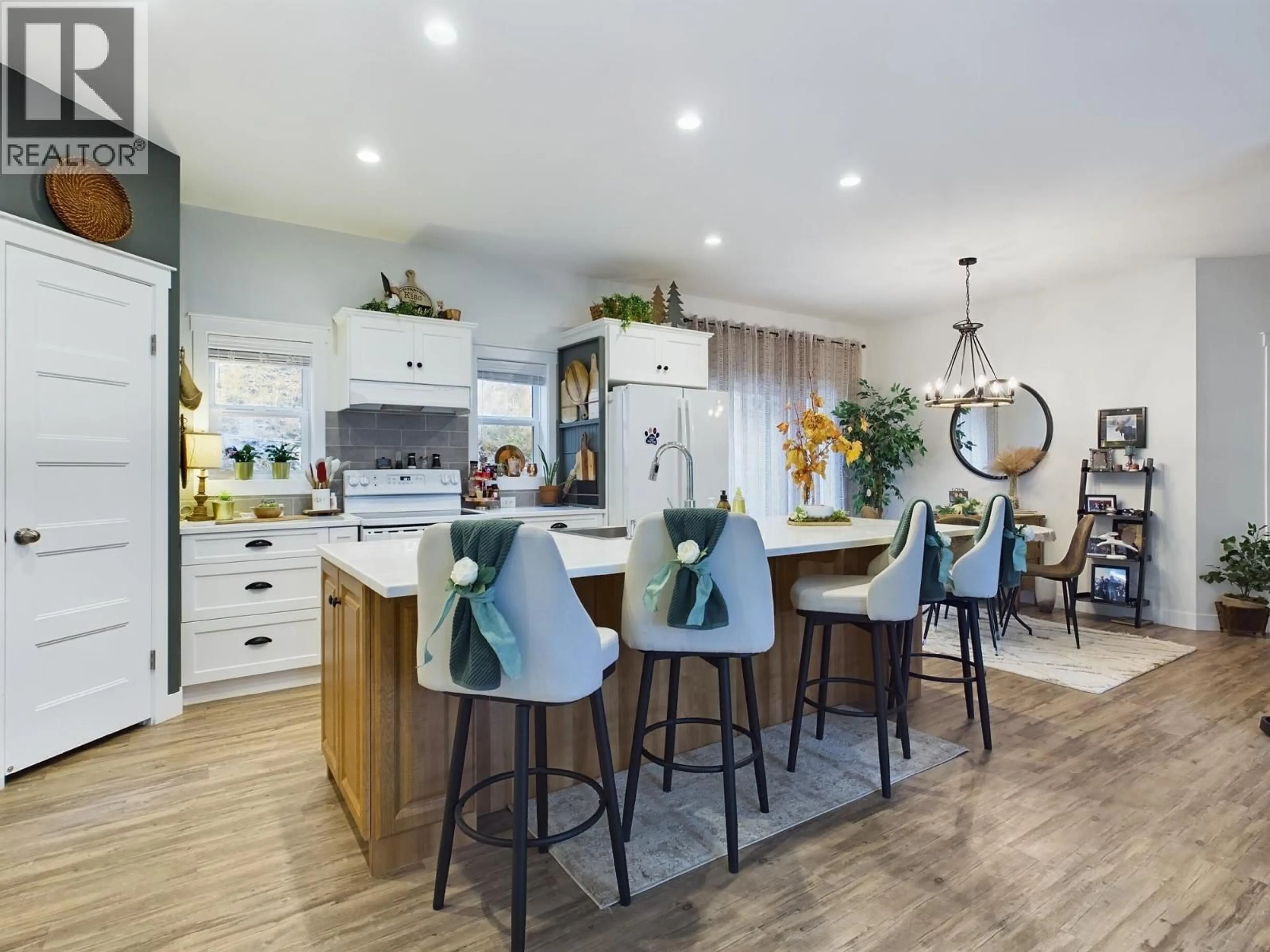 Open concept kitchen, wood/laminate floor for 1020 BULLMOOSE WAY, Osoyoos British Columbia V0H1V6