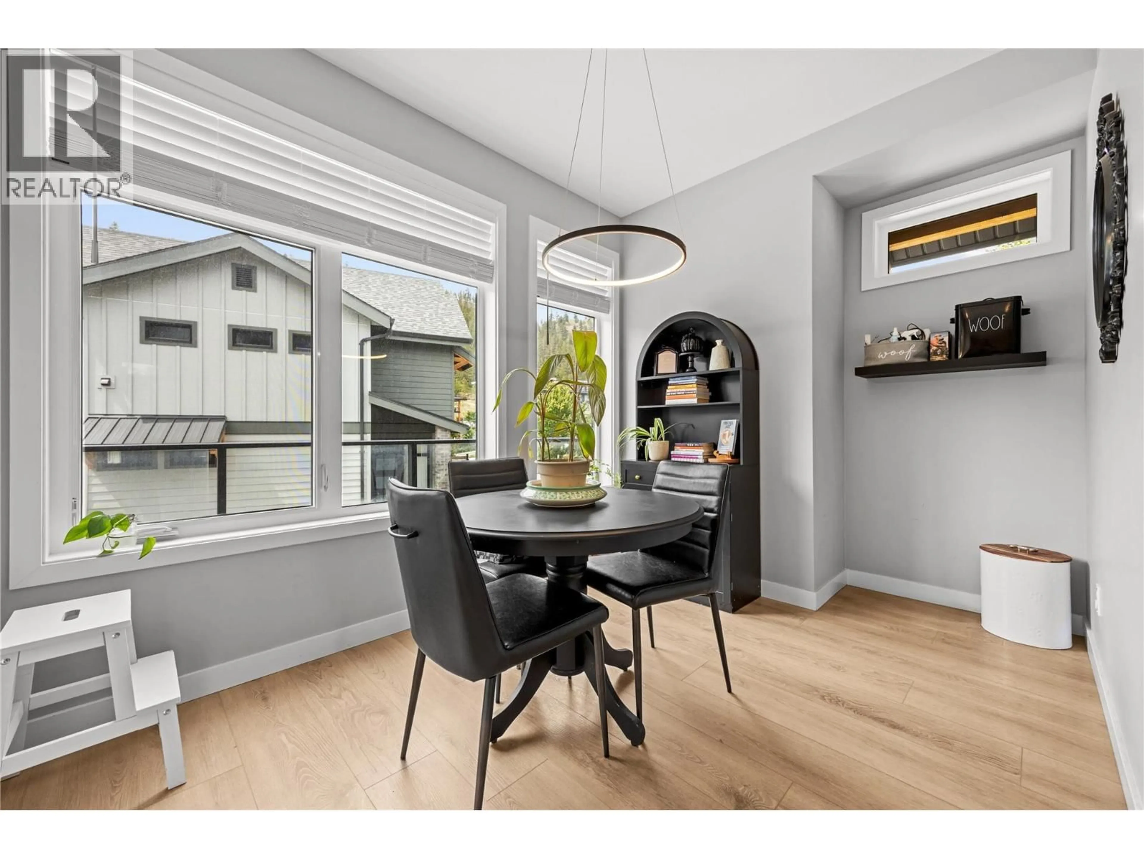 Dining room, wood/laminate floor for 101 - 1435 CARA GLEN COURT, Kelowna British Columbia V1V0G1