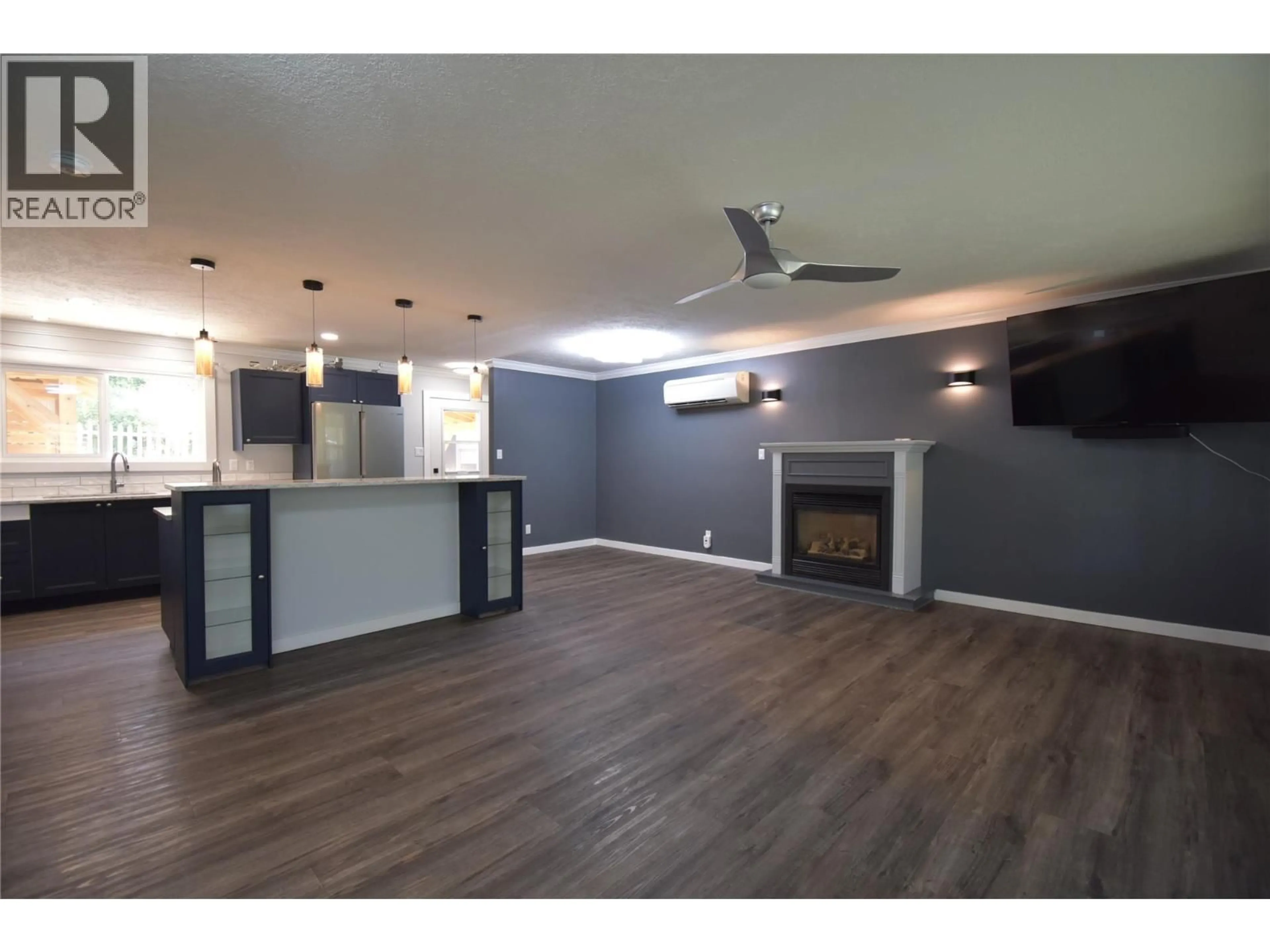 Open concept kitchen, wood/laminate floor for 75 MILL ROAD, Fruitvale British Columbia V0G1L1
