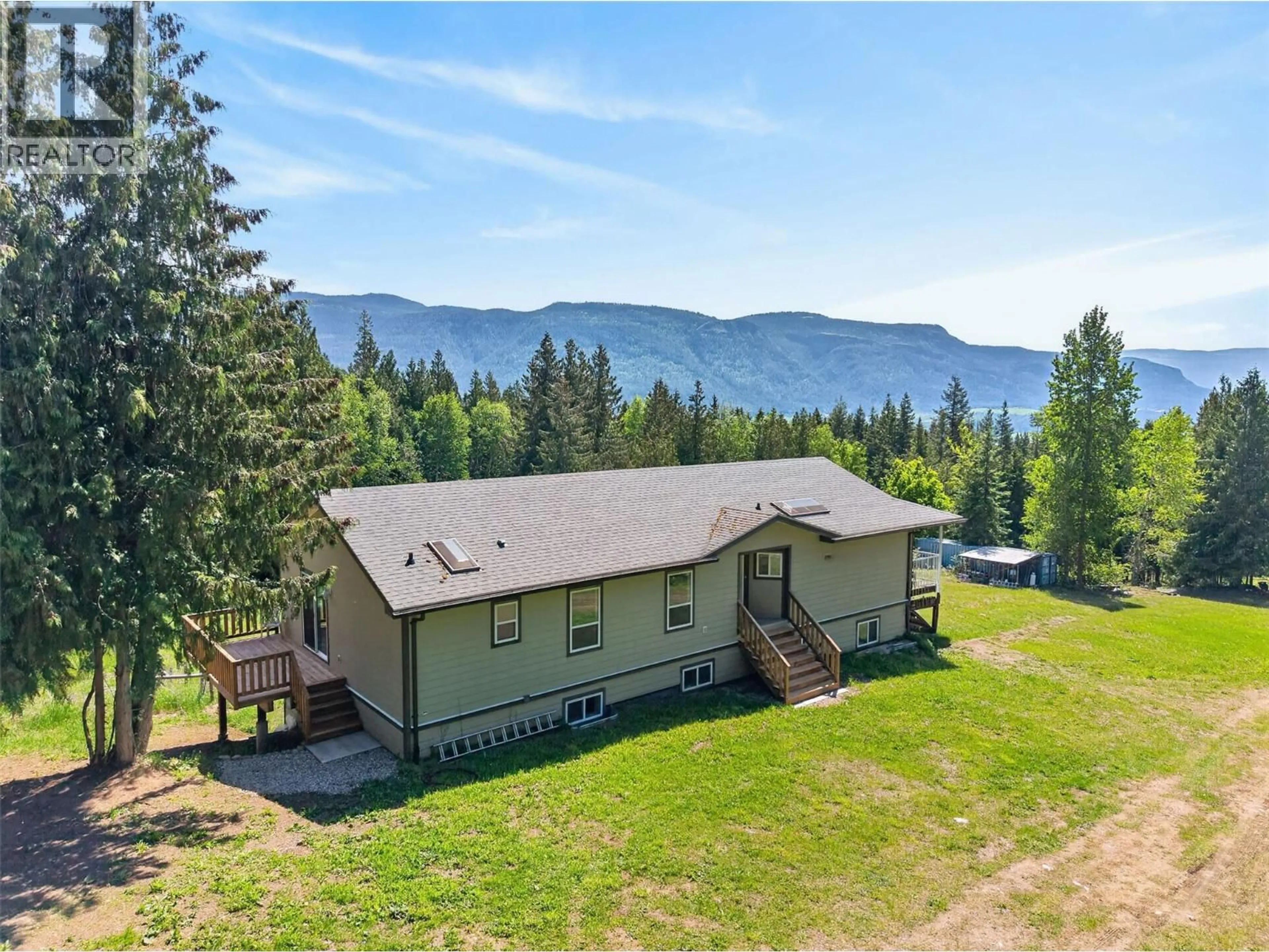 A pic from outside/outdoor area/front of a property/back of a property/a pic from drone, mountain view for 31 VIOLET ROAD, Grindrod British Columbia V0E1Y0