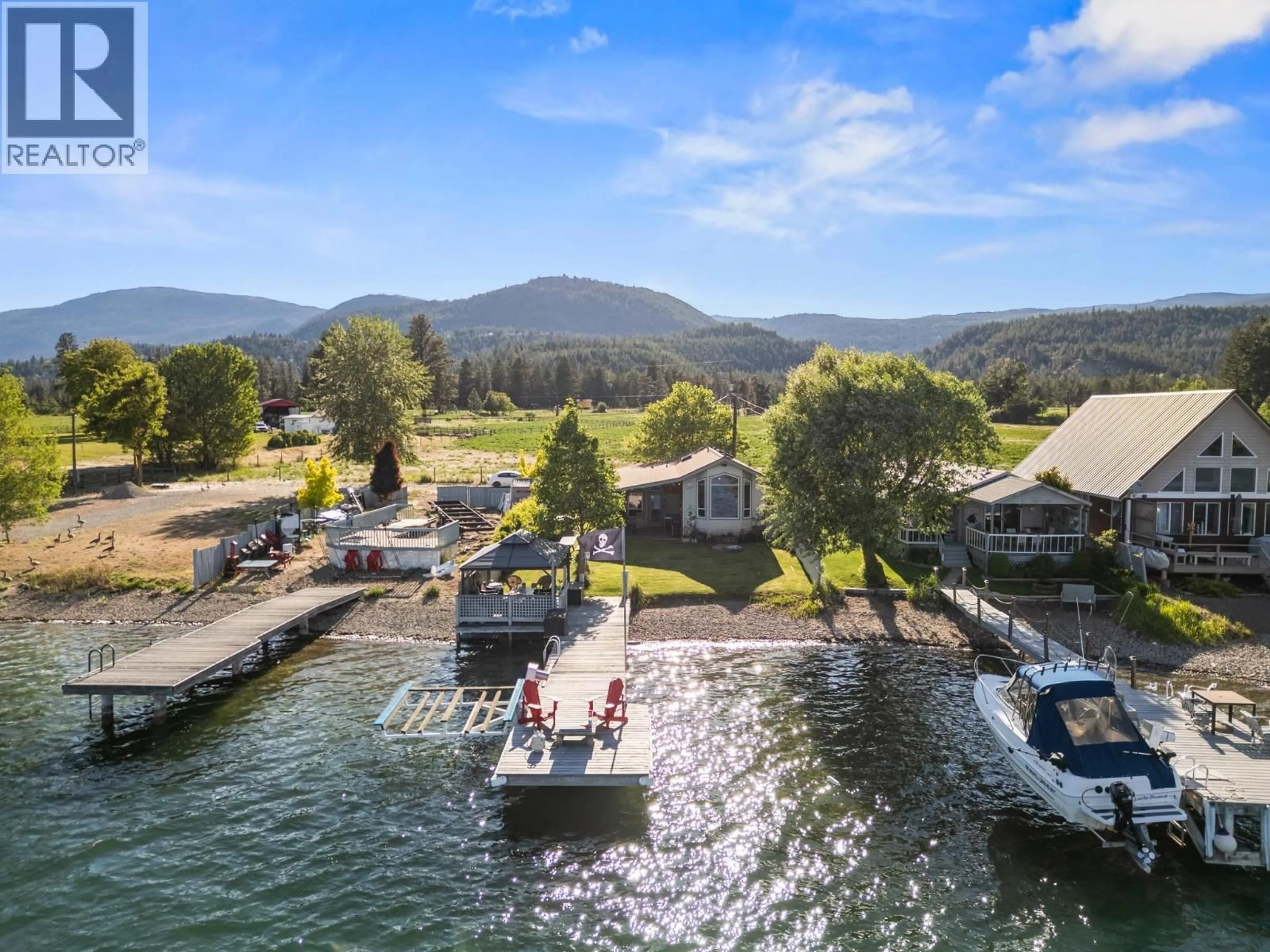 A pic from outside/outdoor area/front of a property/back of a property/a pic from drone, water/lake/river/ocean view for 19 KI LOW NA ROAD, Vernon British Columbia V1H2h3