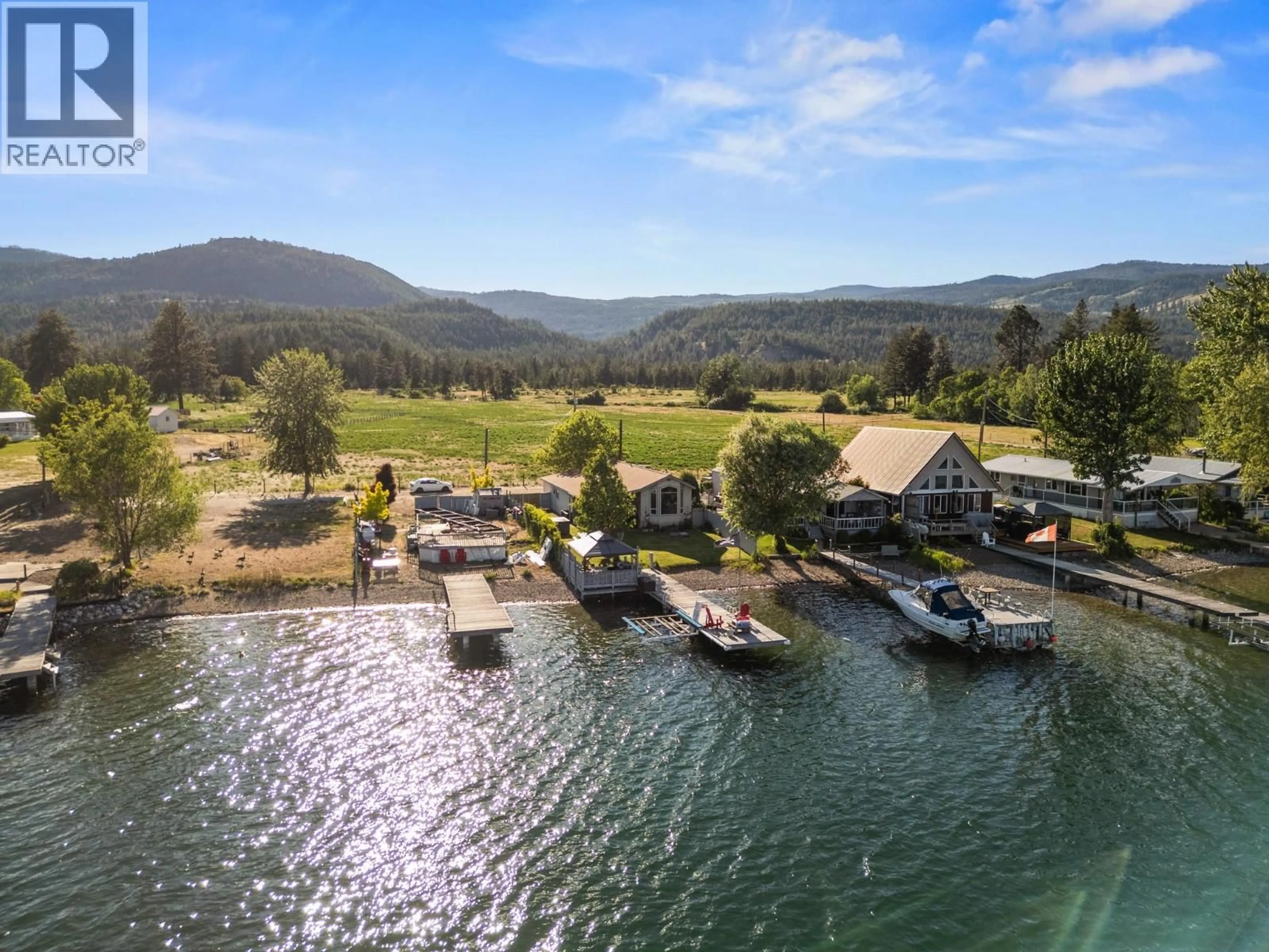 A pic from outside/outdoor area/front of a property/back of a property/a pic from drone, water/lake/river/ocean view for 19 KI LOW NA ROAD, Vernon British Columbia V1H2h3