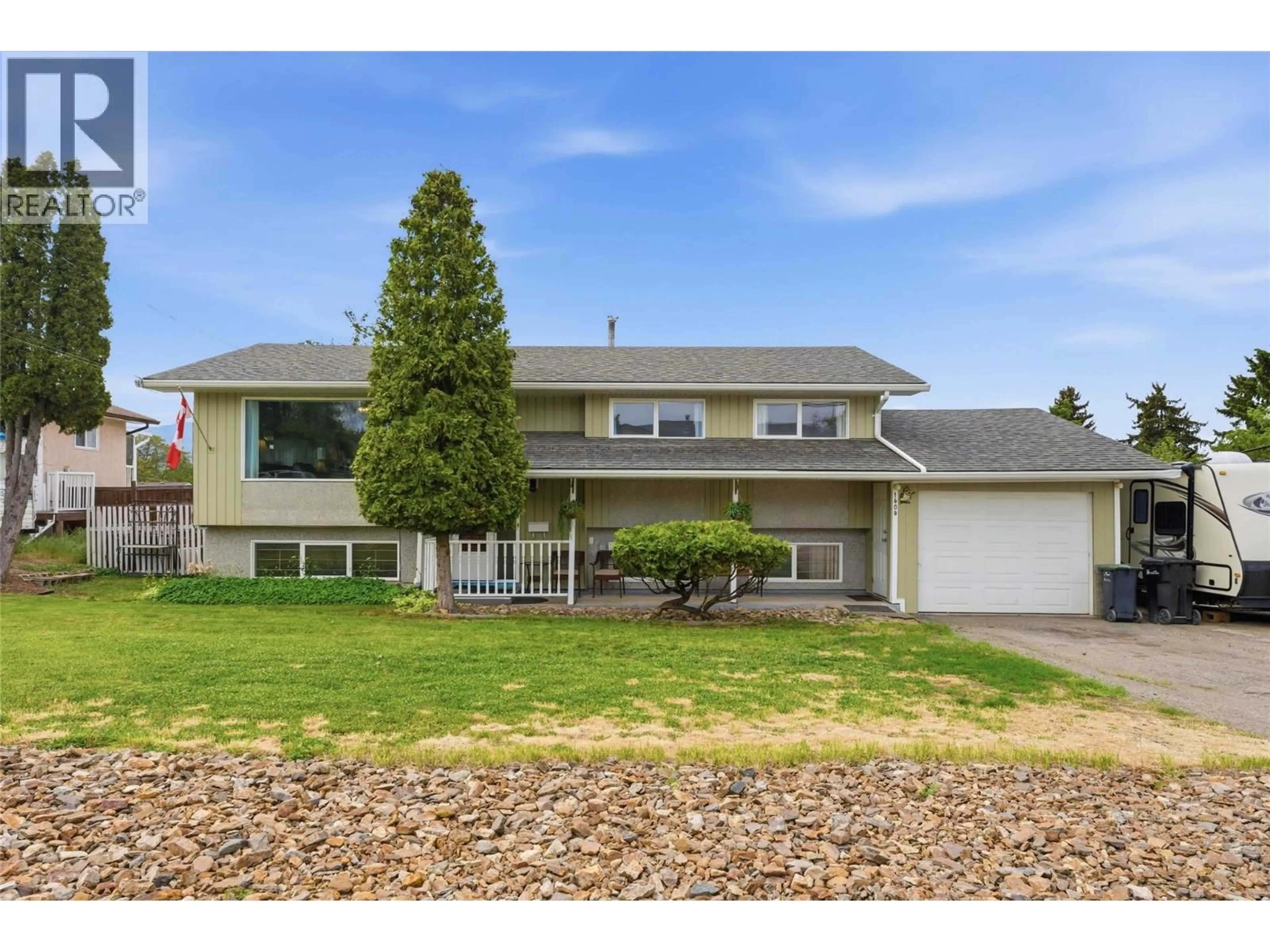 Home with vinyl exterior material, street for 1404 30 AVENUE, Vernon British Columbia V1T1Z5