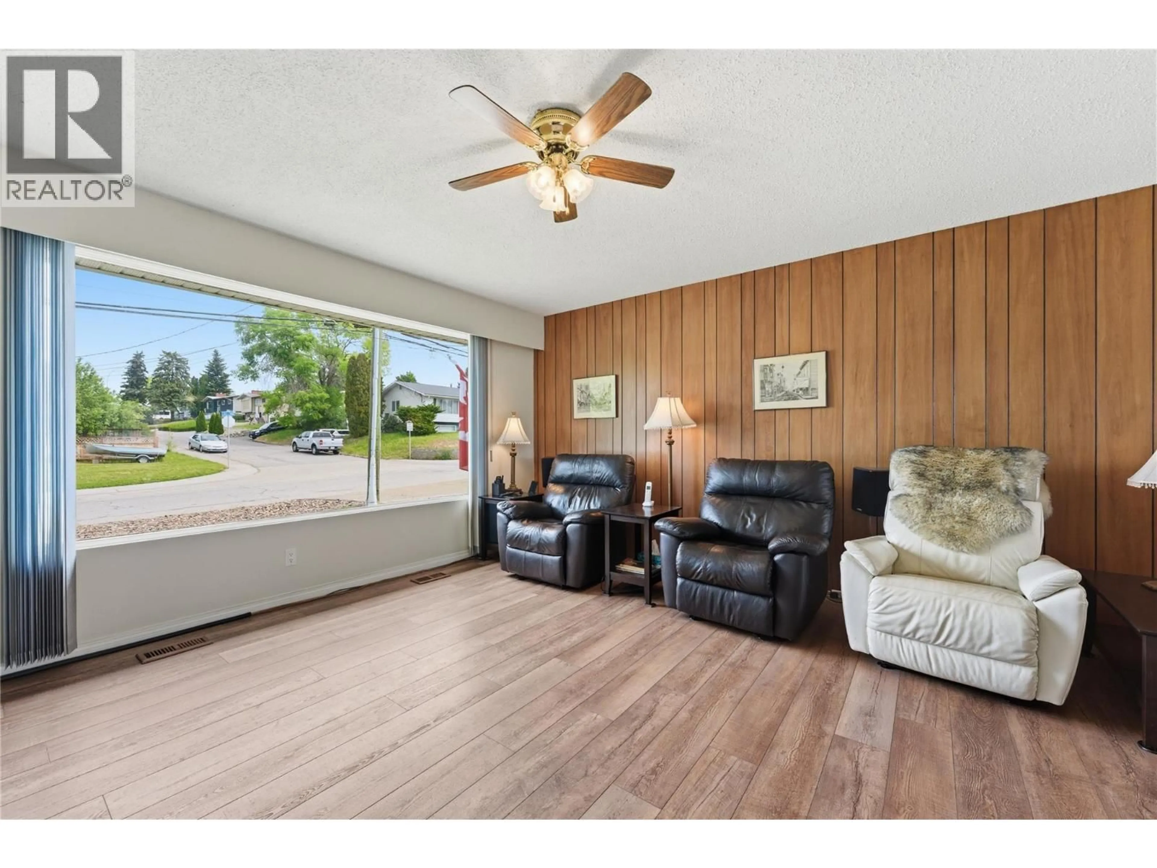 Living room with furniture, wood/laminate floor for 1404 30 AVENUE, Vernon British Columbia V1T1Z5