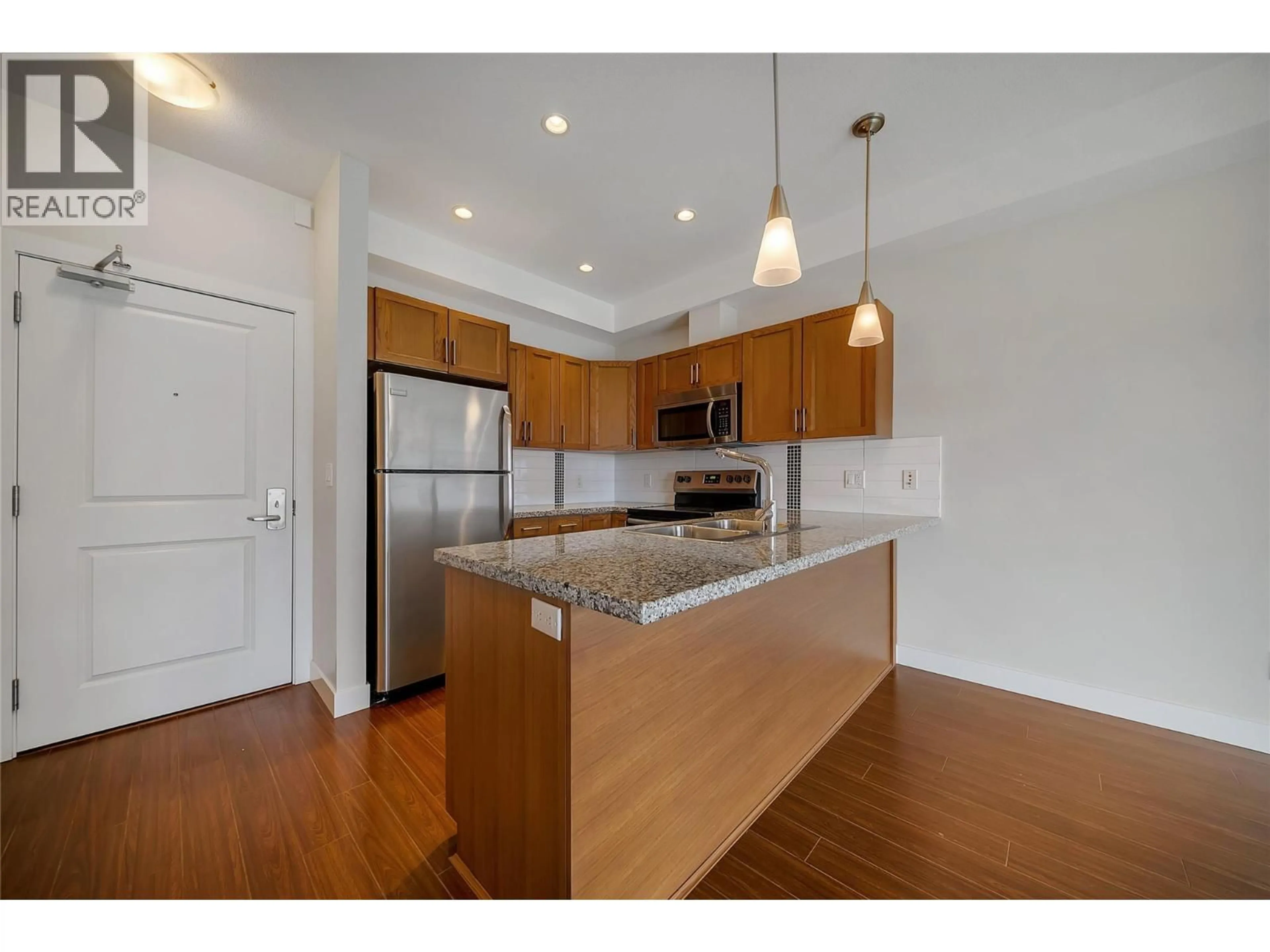Open concept kitchen, wood/laminate floor for 302 - 3220 SKYVIEW LANE, West Kelowna British Columbia V4T3J4