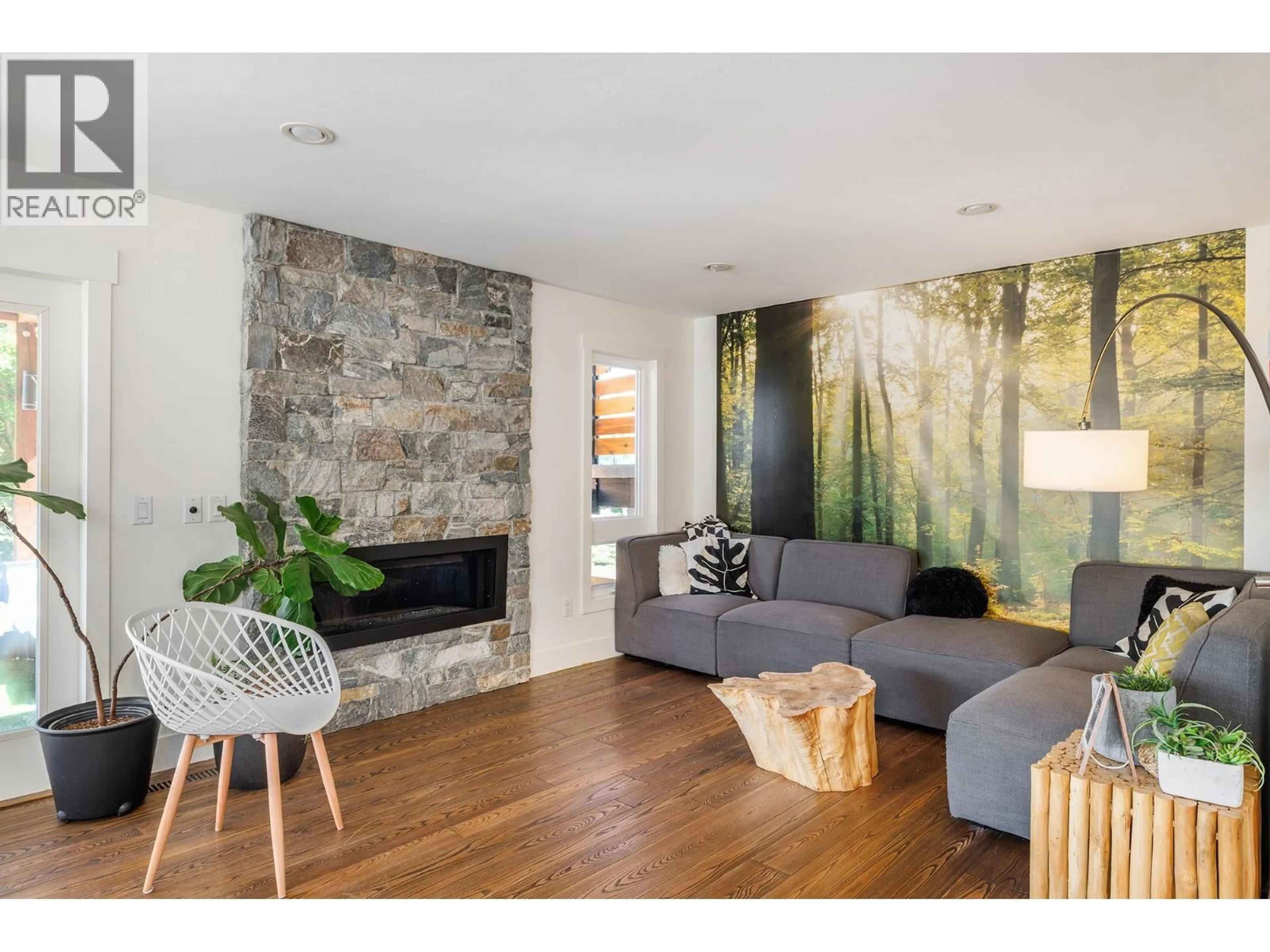 Living room with furniture, wood/laminate floor for 2020 GOLDIE ROAD, Lake Country British Columbia V4V1G5