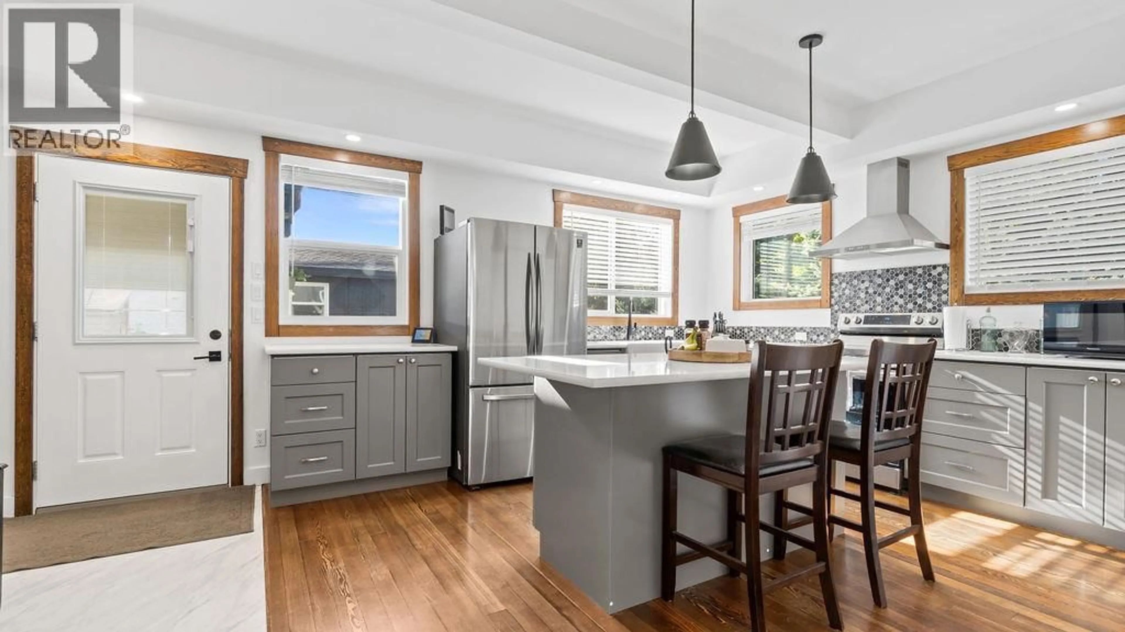 Open concept kitchen, wood/laminate floor for 98 2ND AVENUE NORTHWEST, Nakusp British Columbia V0G1R0