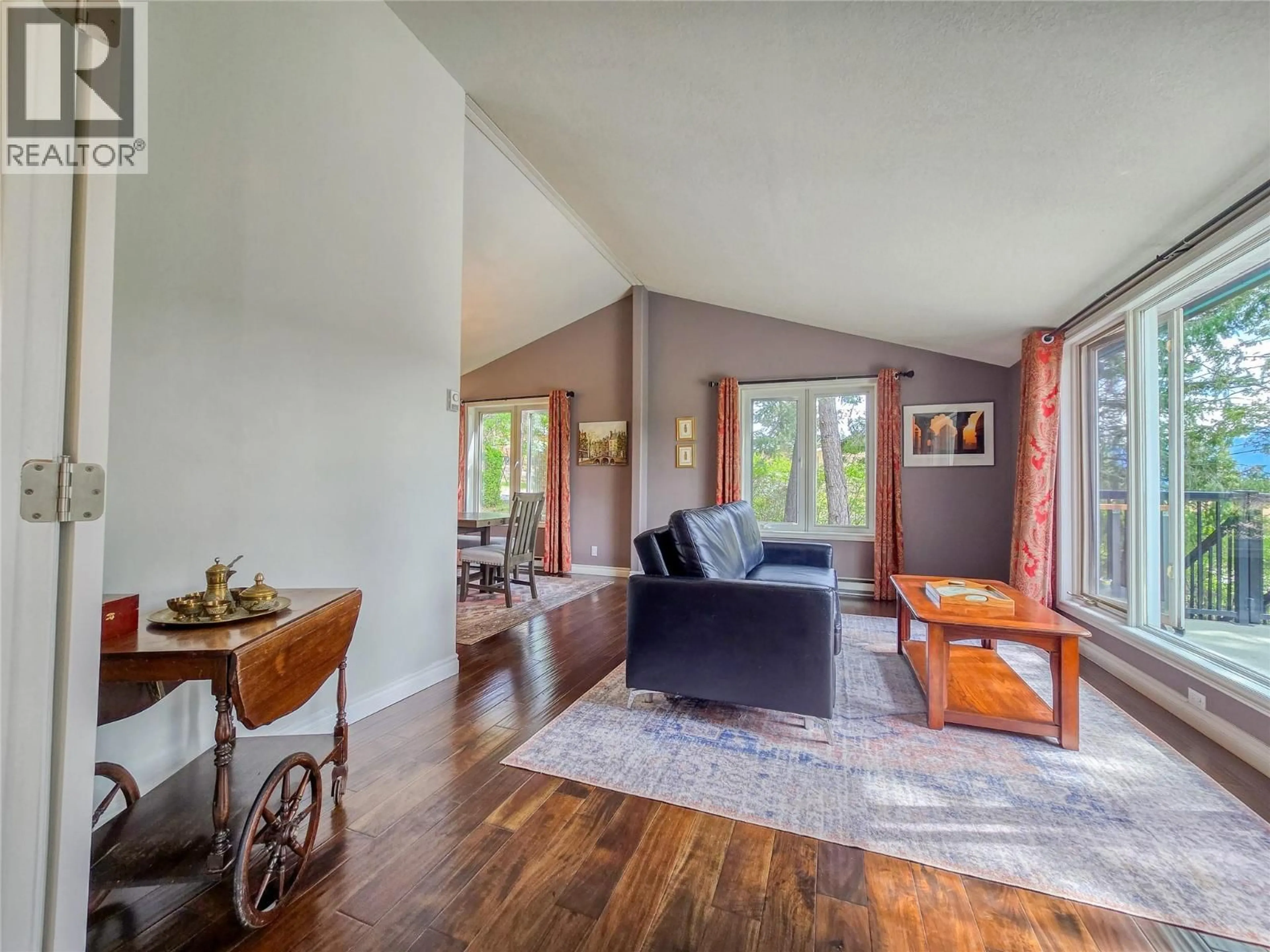 Living room with furniture, wood/laminate floor for 4938 HOT SPRINGS ROAD, Fairmont Hot Springs British Columbia V0B1L1