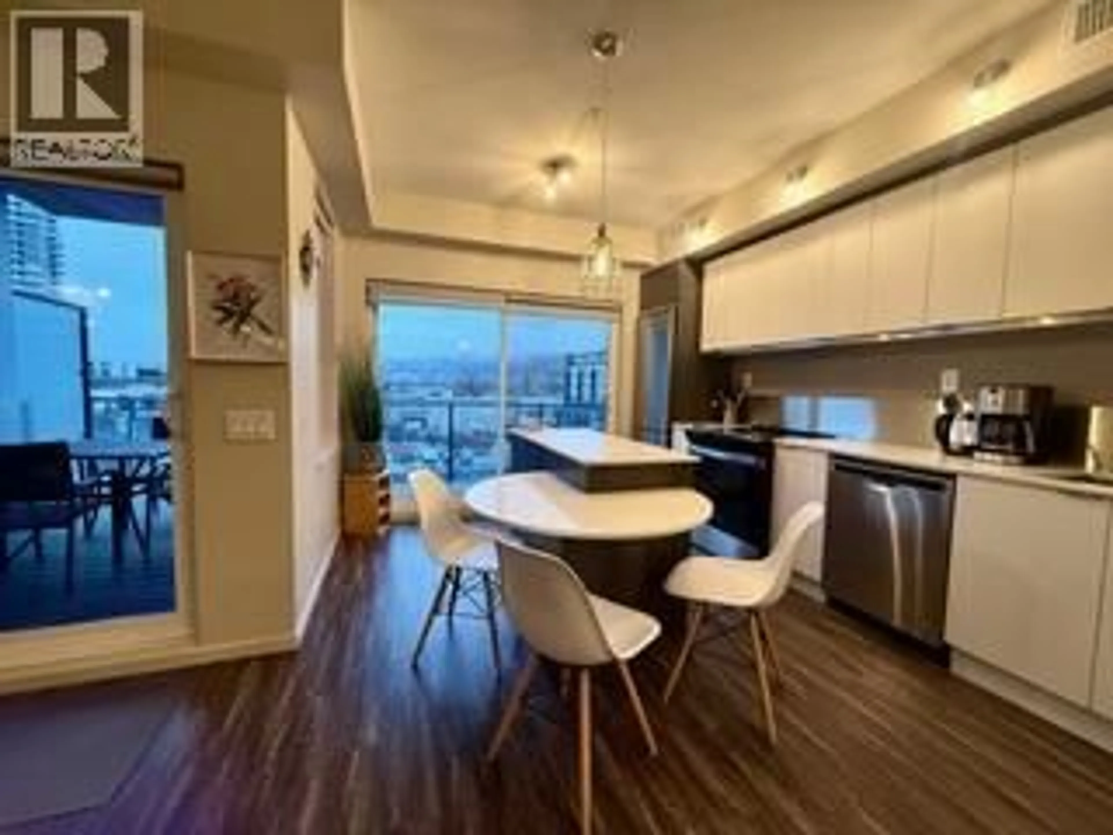 Open concept kitchen, wood/laminate floor for 403 - 1290 ST. PAUL STREET, Kelowna British Columbia V1Y2C9