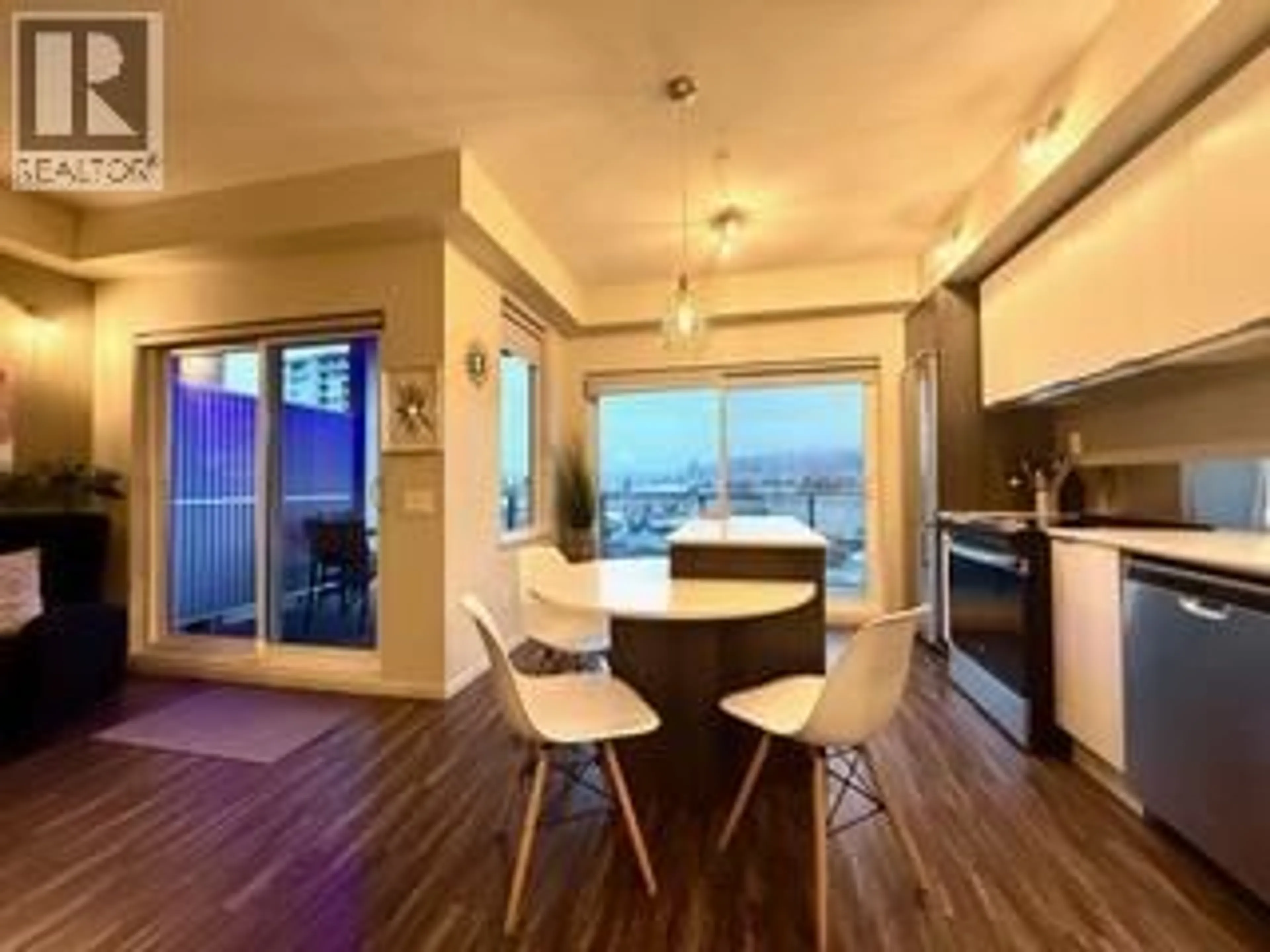 Open concept kitchen, wood/laminate floor for 403 - 1290 ST. PAUL STREET, Kelowna British Columbia V1Y2C9