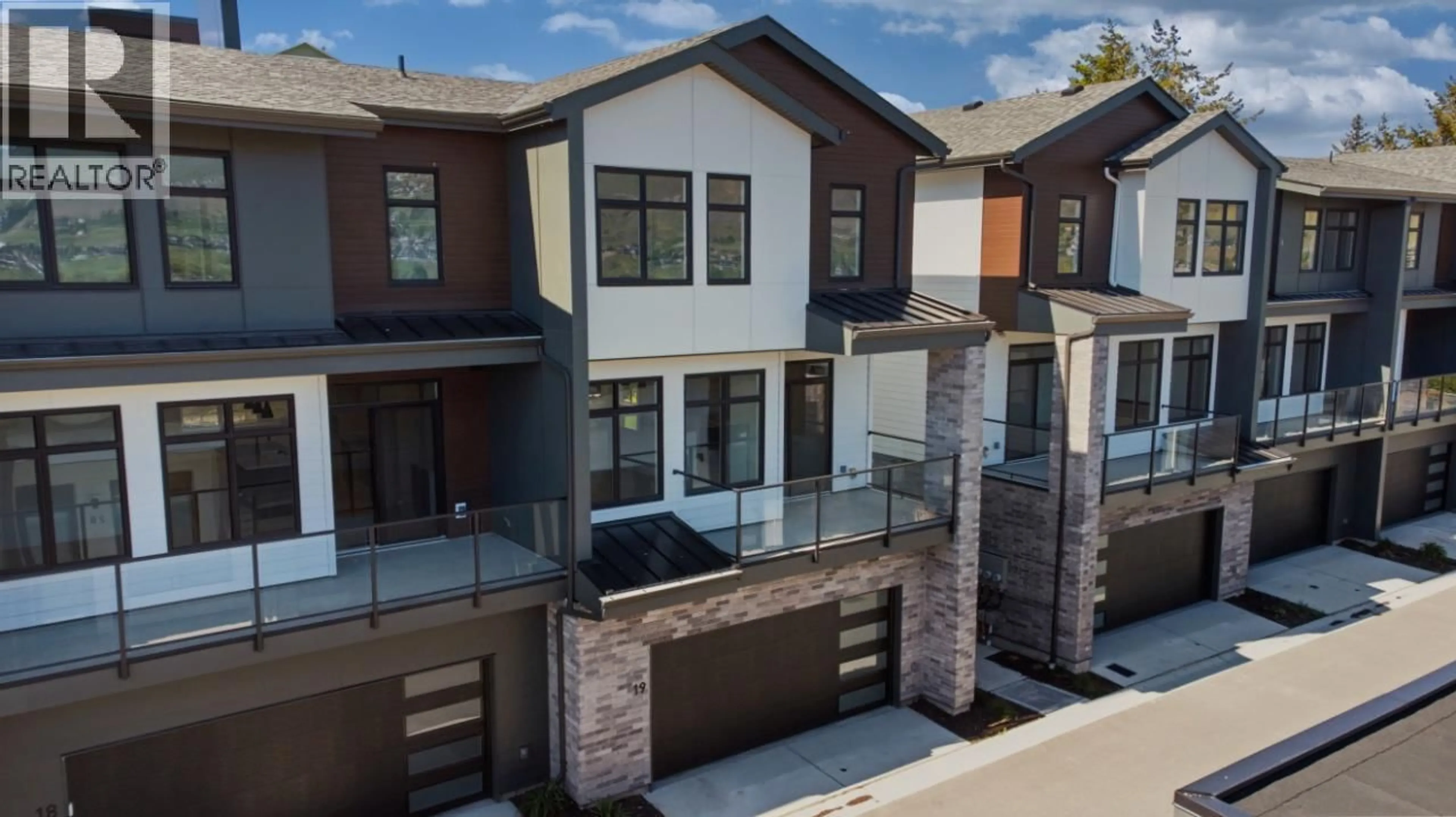 Home with brick exterior material, street for 19 - 7599 KLINGER ROAD, Okanagan Landing British Columbia V1H0B2
