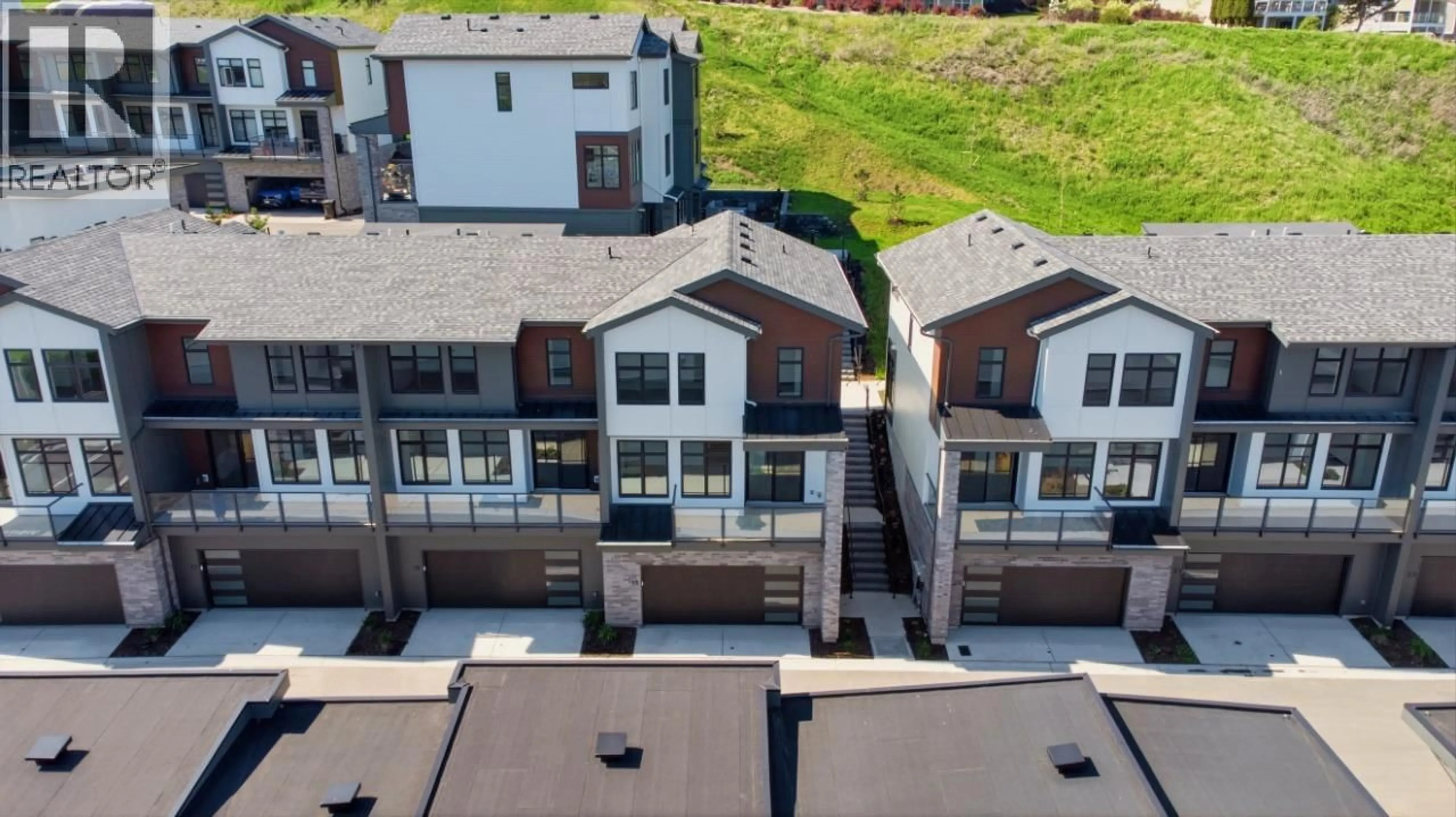 A pic from outside/outdoor area/front of a property/back of a property/a pic from drone, city buildings view from balcony for 19 - 7599 KLINGER ROAD, Okanagan Landing British Columbia V1H0B2