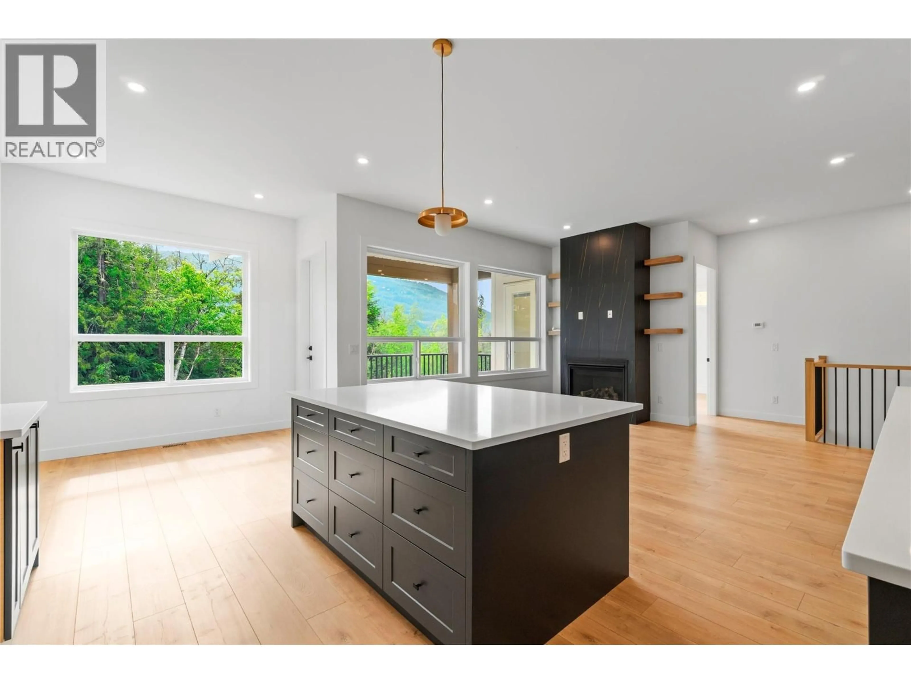 Open concept kitchen, wood/laminate floor for 6800 42 STREET NORTHEAST, Salmon Arm British Columbia V0E1K0