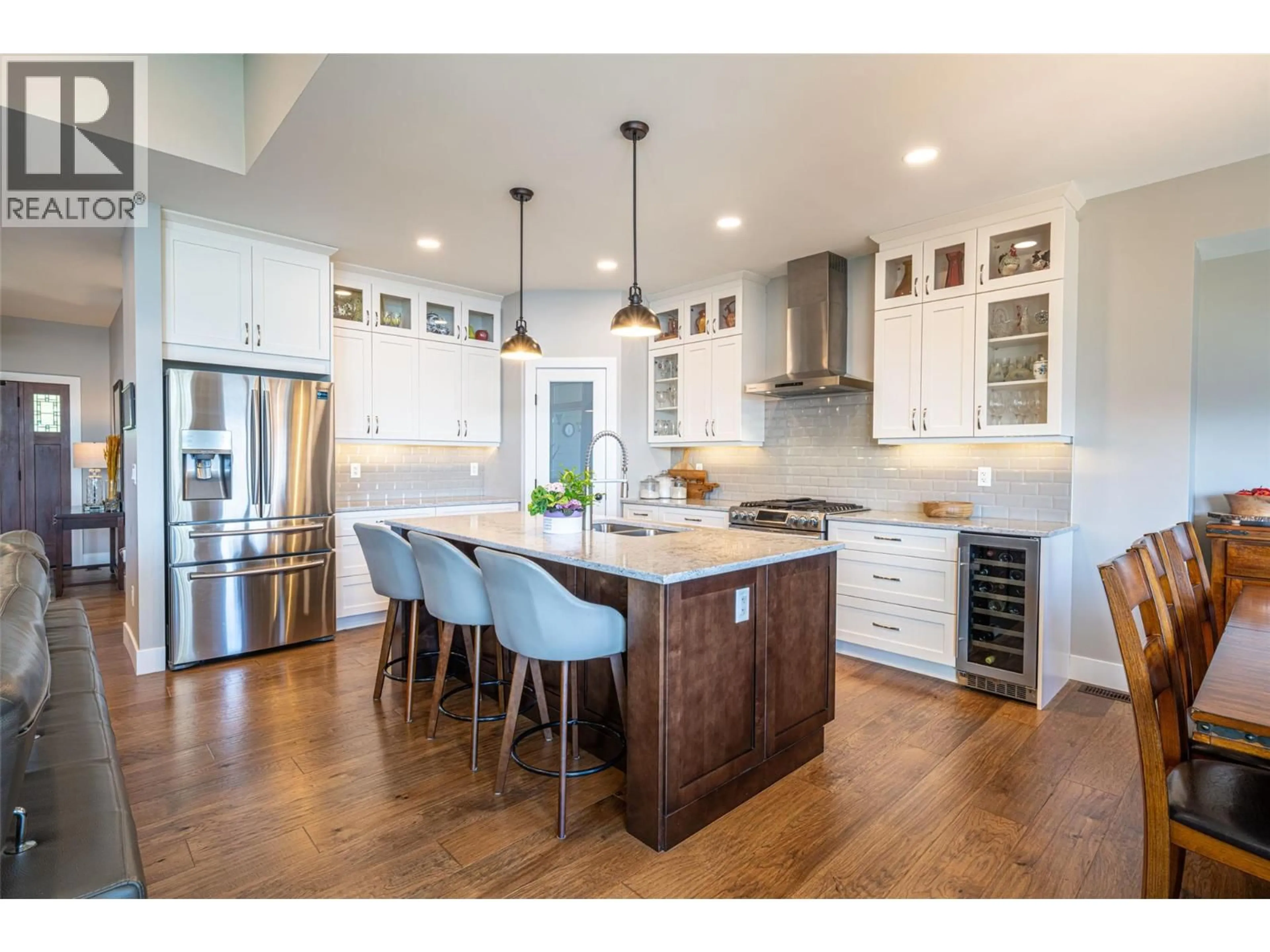 Open concept kitchen, wood/laminate floor for 132 CROWN CRESCENT, Vernon British Columbia V1H2C3