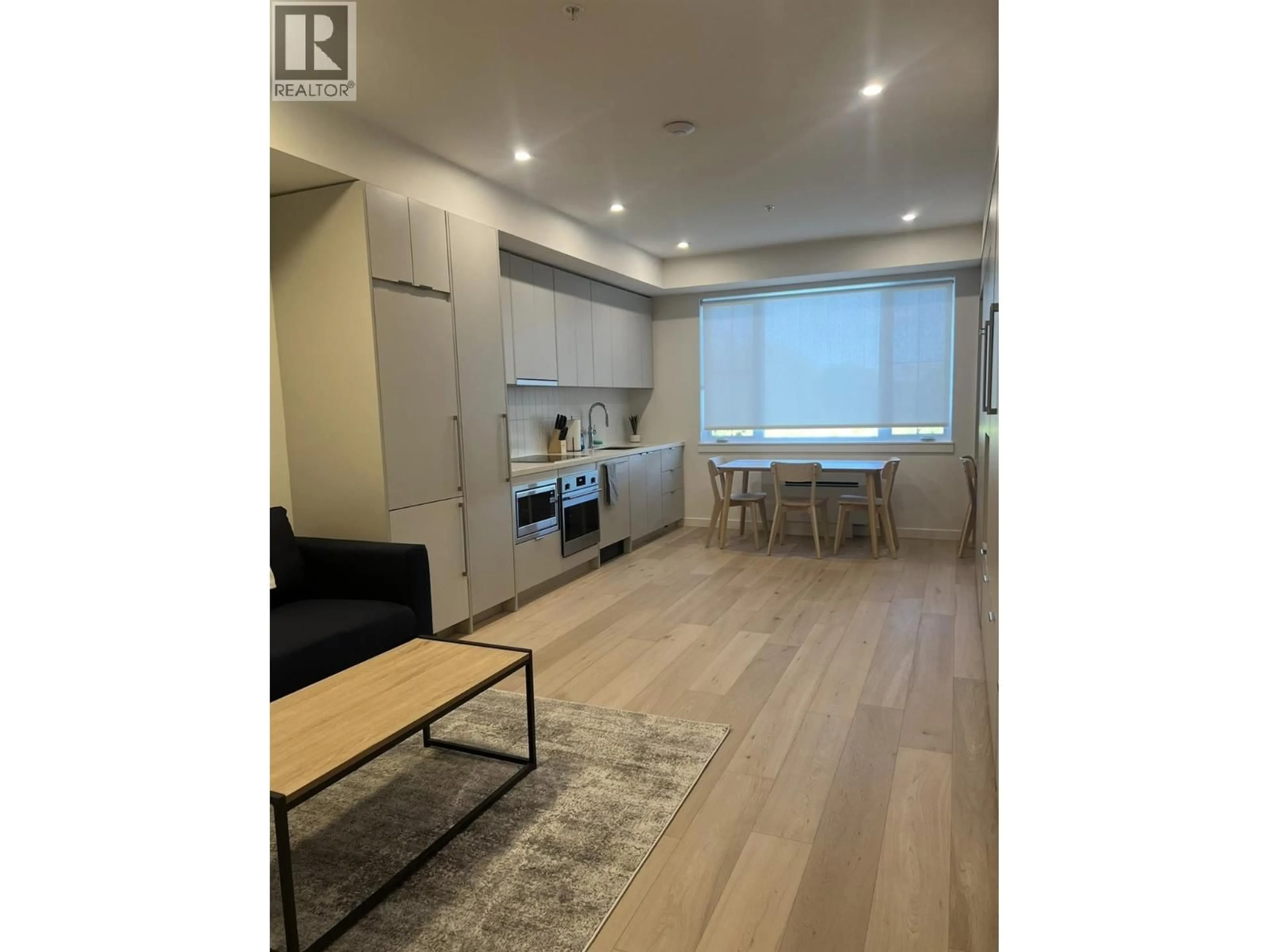 Open concept kitchen, wood/laminate floor for 215 - 4280 RED MOUNTAIN ROAD, Rossland British Columbia V0G1Y0