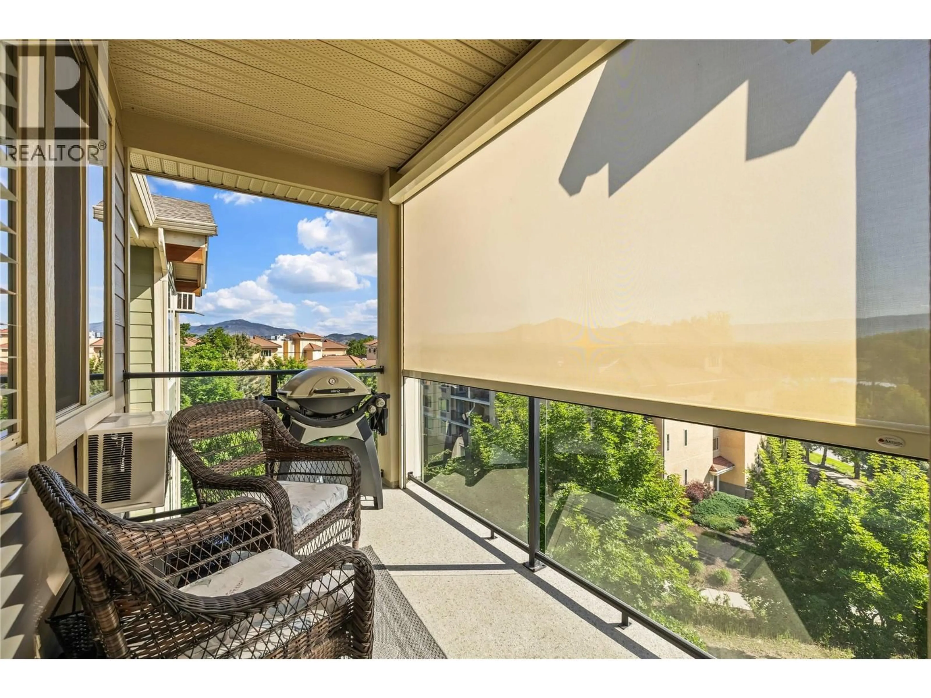 A pic from outside/outdoor area/front of a property/back of a property/a pic from drone, unknown for 410 - 3735 CASORSO ROAD, Kelowna British Columbia V1W5G1