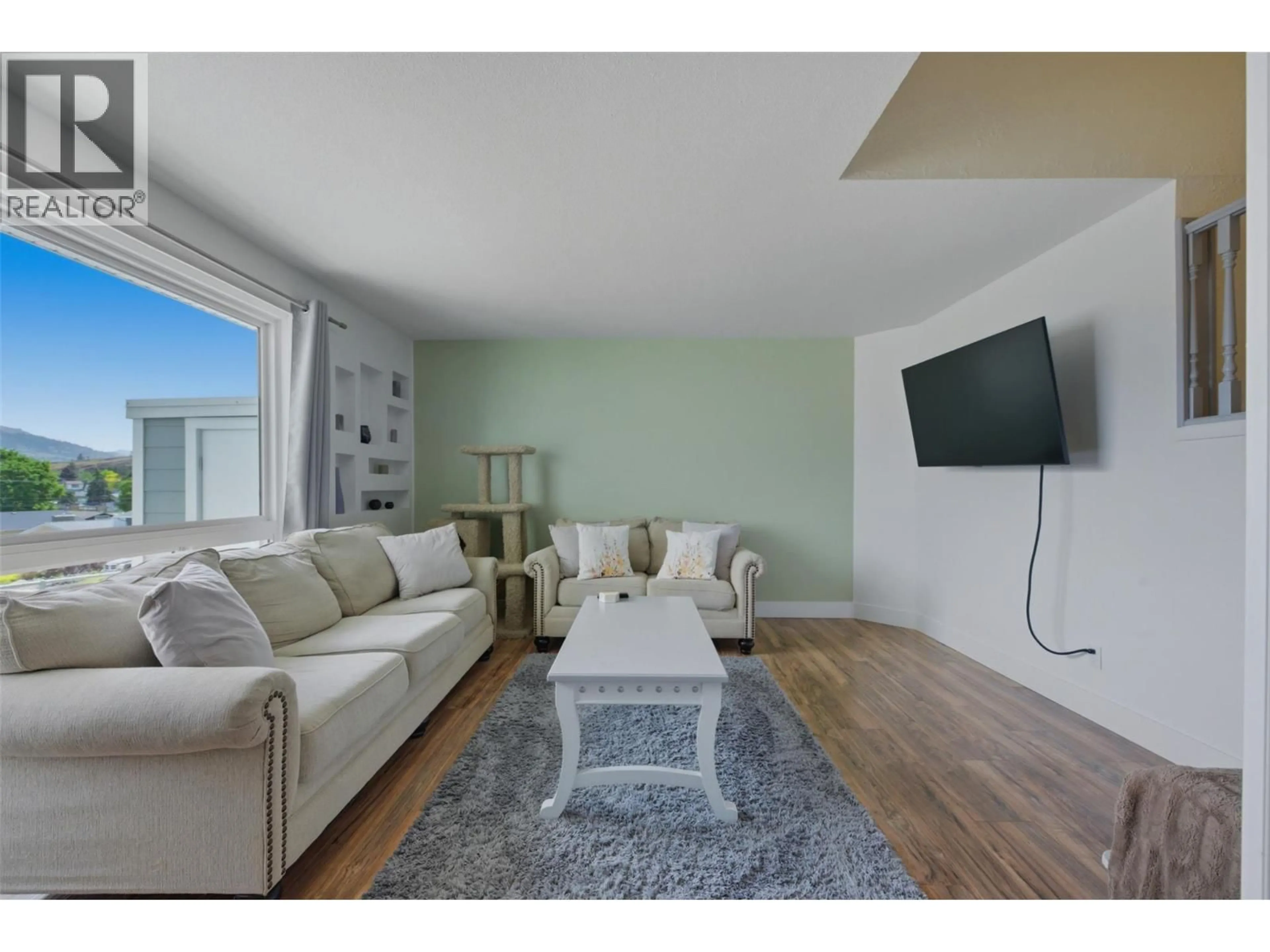 Living room with furniture, wood/laminate floor for 33 - 3800 40 AVENUE, Vernon British Columbia V1T6S3