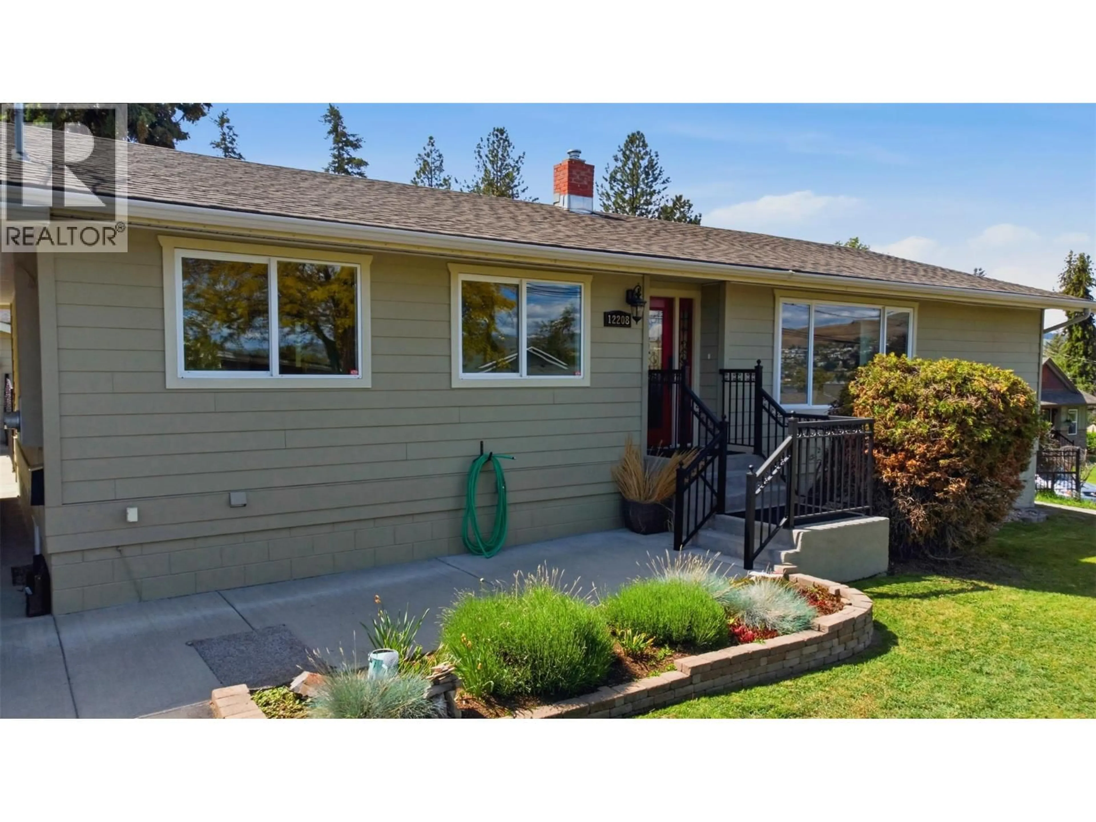 Home with vinyl exterior material, street for 12208 COLDSTREAM CREEK ROAD, Coldstream British Columbia V1B1G1