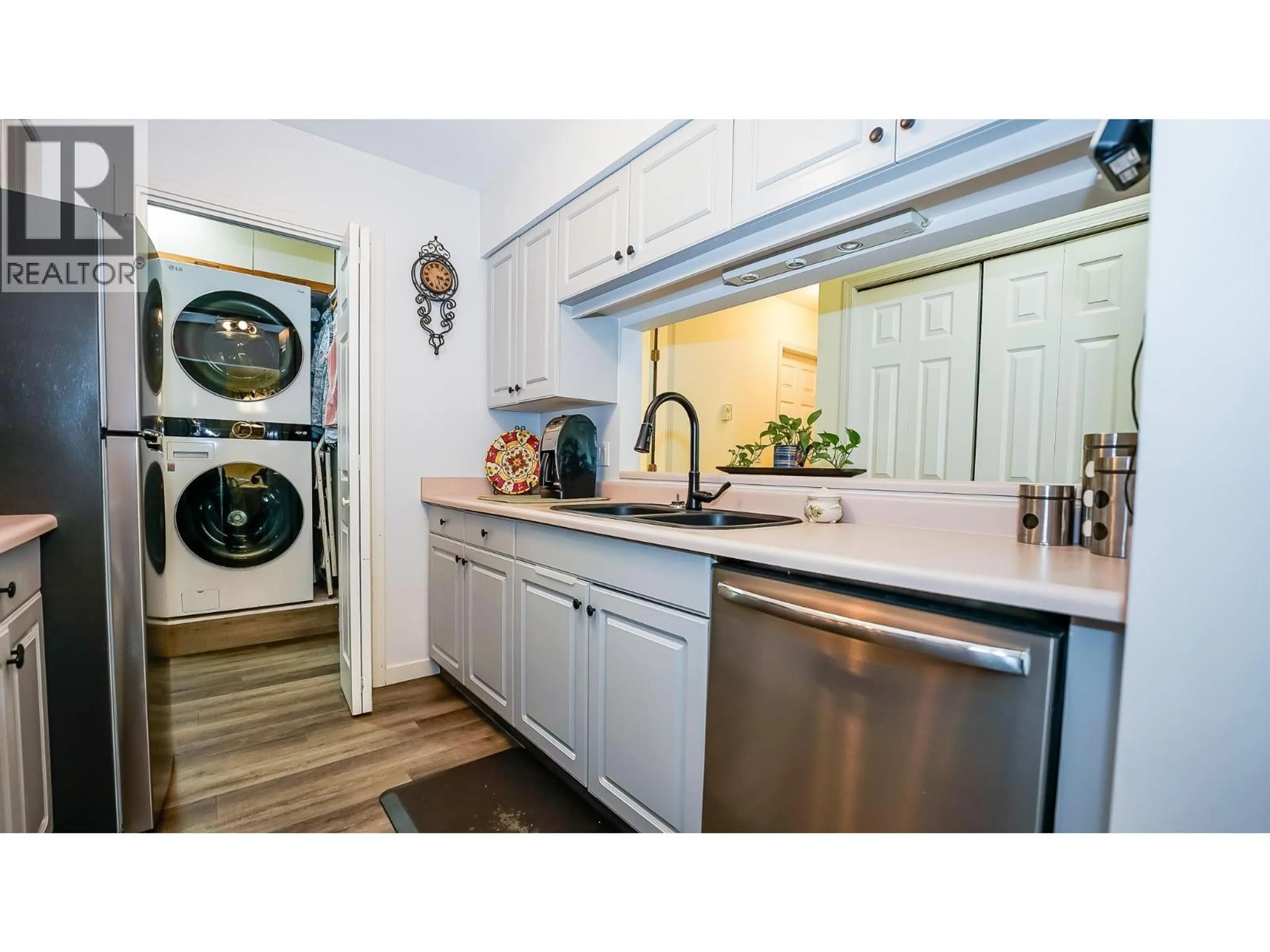 Kitchen with laundary machines, unknown for 408 - 650 THIRD STREET SOUTHWEST, Salmon Arm British Columbia V1E1P6
