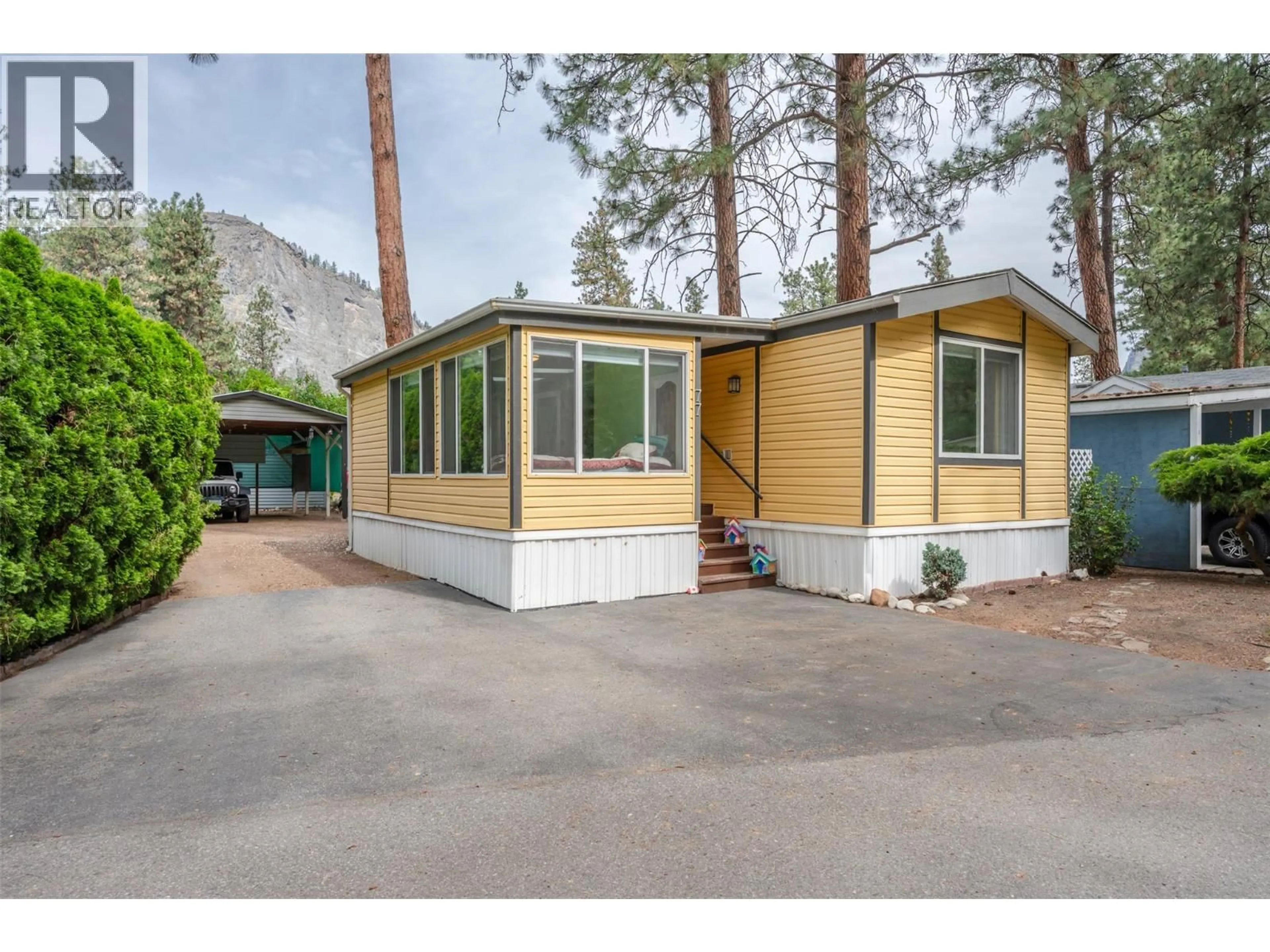 Home with vinyl exterior material, street for 77 - 8487 97 HIGHWAY, Oliver British Columbia V0H1T2