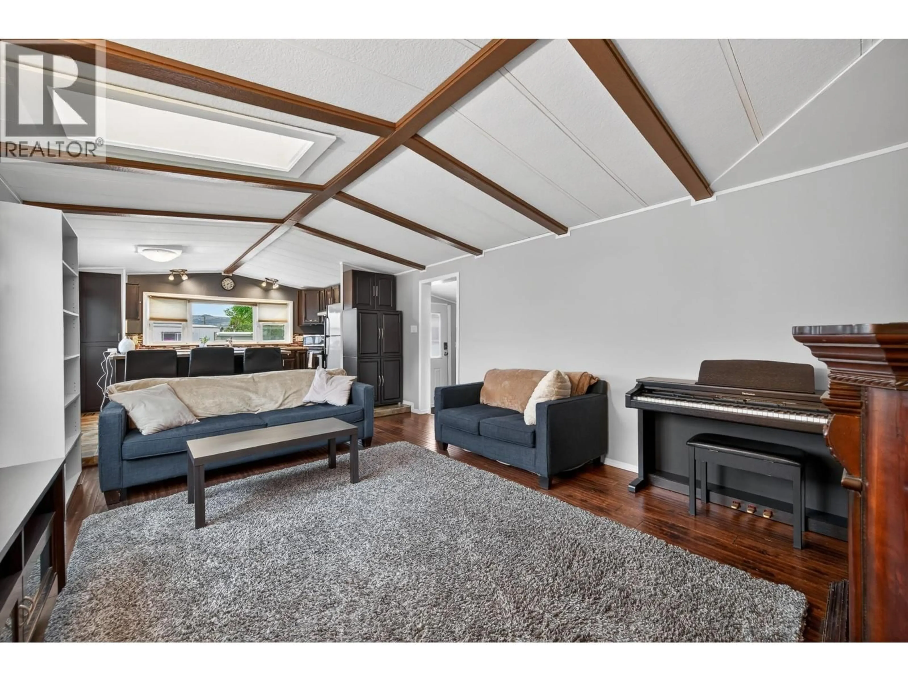 Living room with furniture, wood/laminate floor for 22 - 1375 ORD ROAD, Kamloops British Columbia V2B7V3