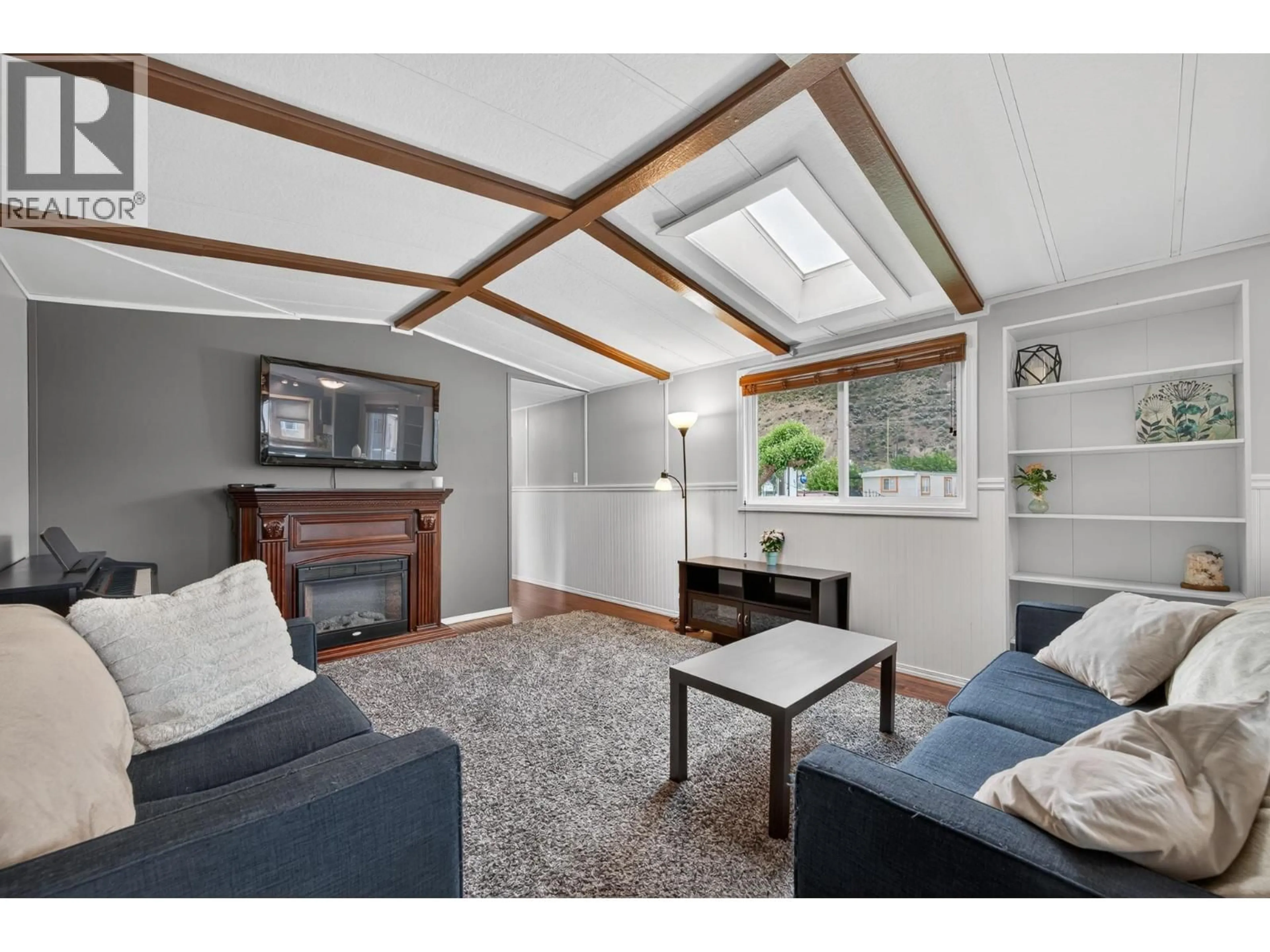 Living room with furniture, wood/laminate floor for 22 - 1375 ORD ROAD, Kamloops British Columbia V2B7V3
