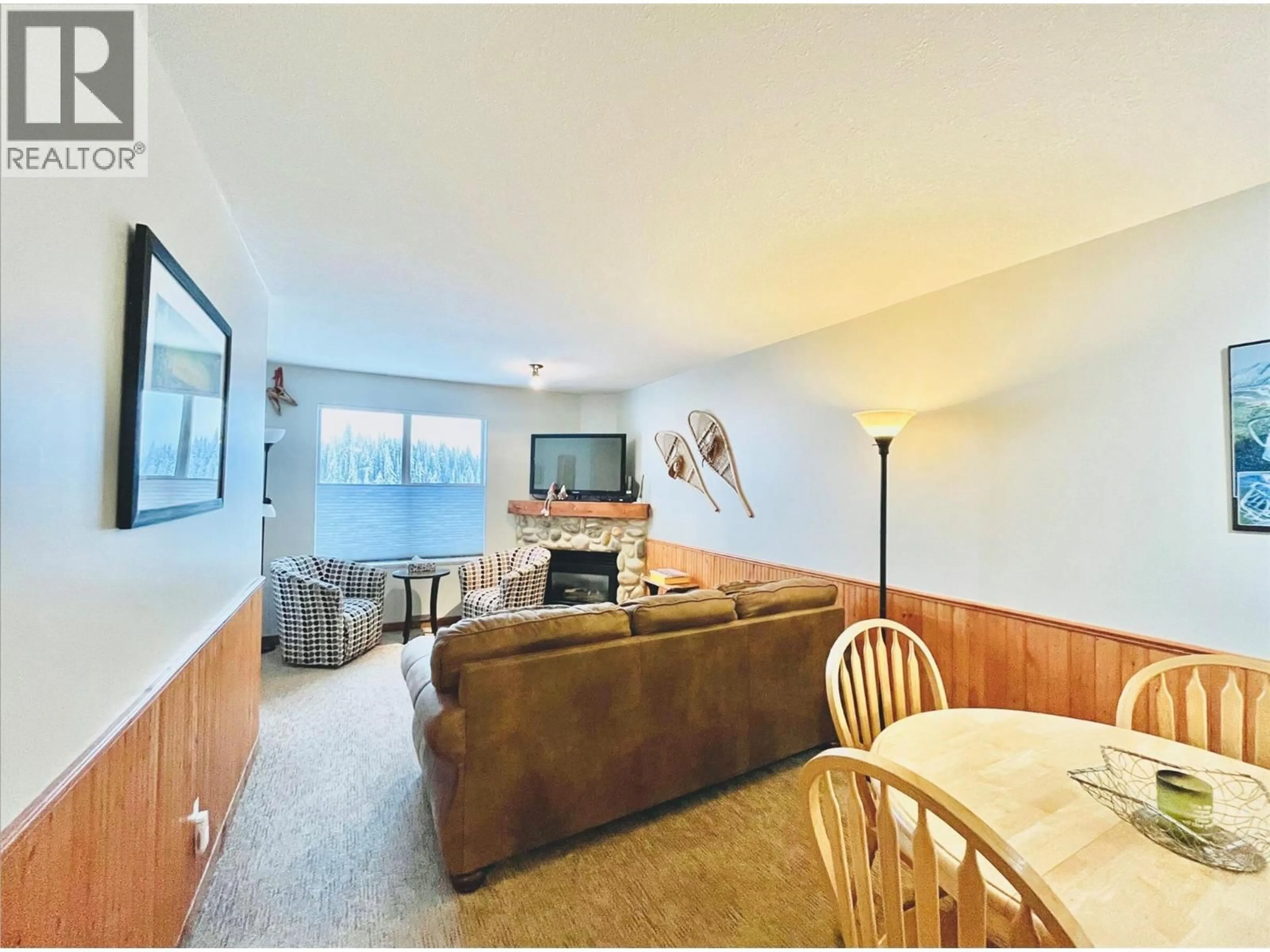 Living room with furniture, wood/laminate floor for 205 - 9802 SILVER STAR ROAD, Vernon British Columbia V1B3W9