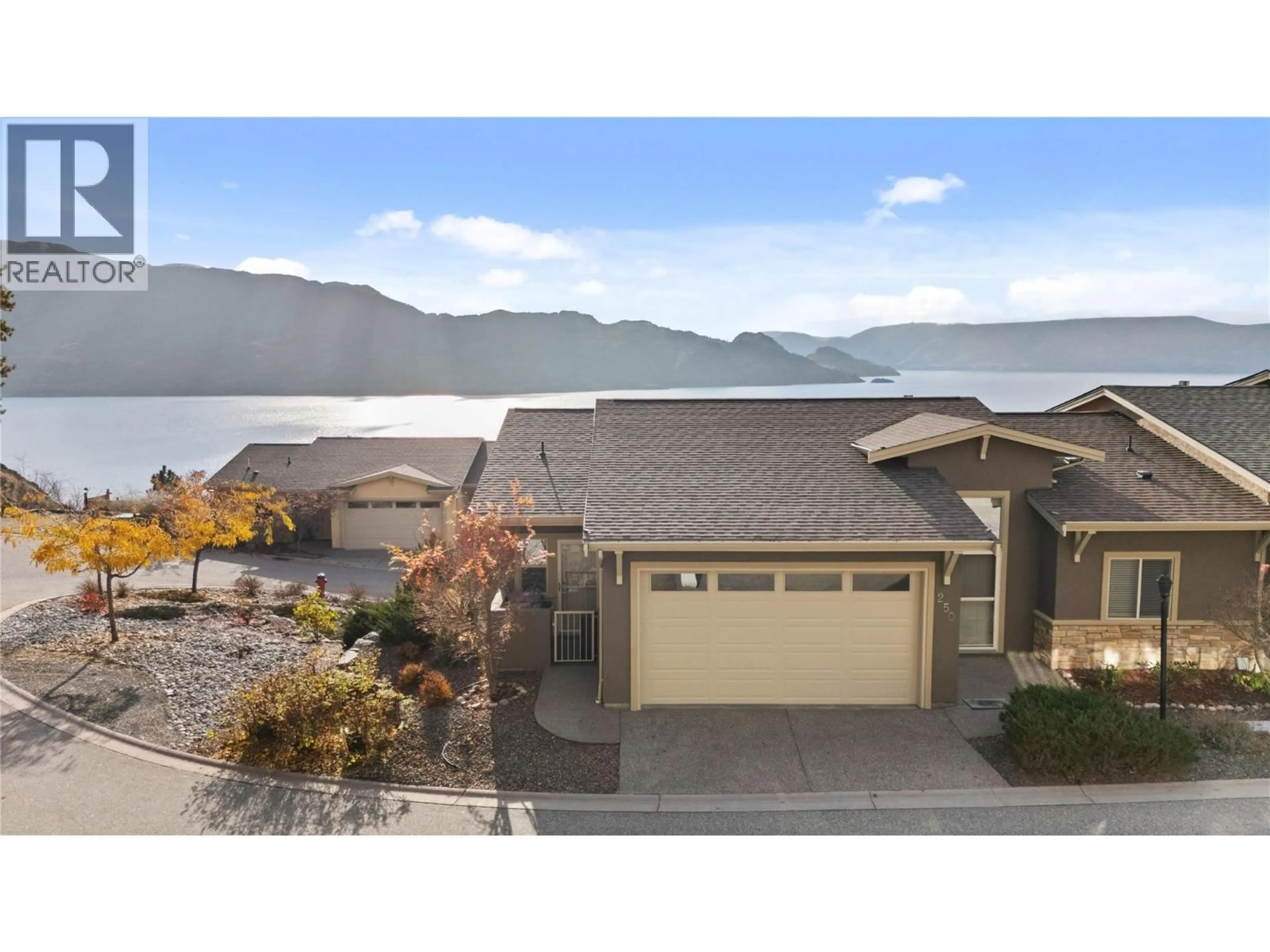 A pic from outside/outdoor area/front of a property/back of a property/a pic from drone, water/lake/river/ocean view for 250 - 5165 TREPANIER BENCH ROAD, Peachland British Columbia V0H1X2