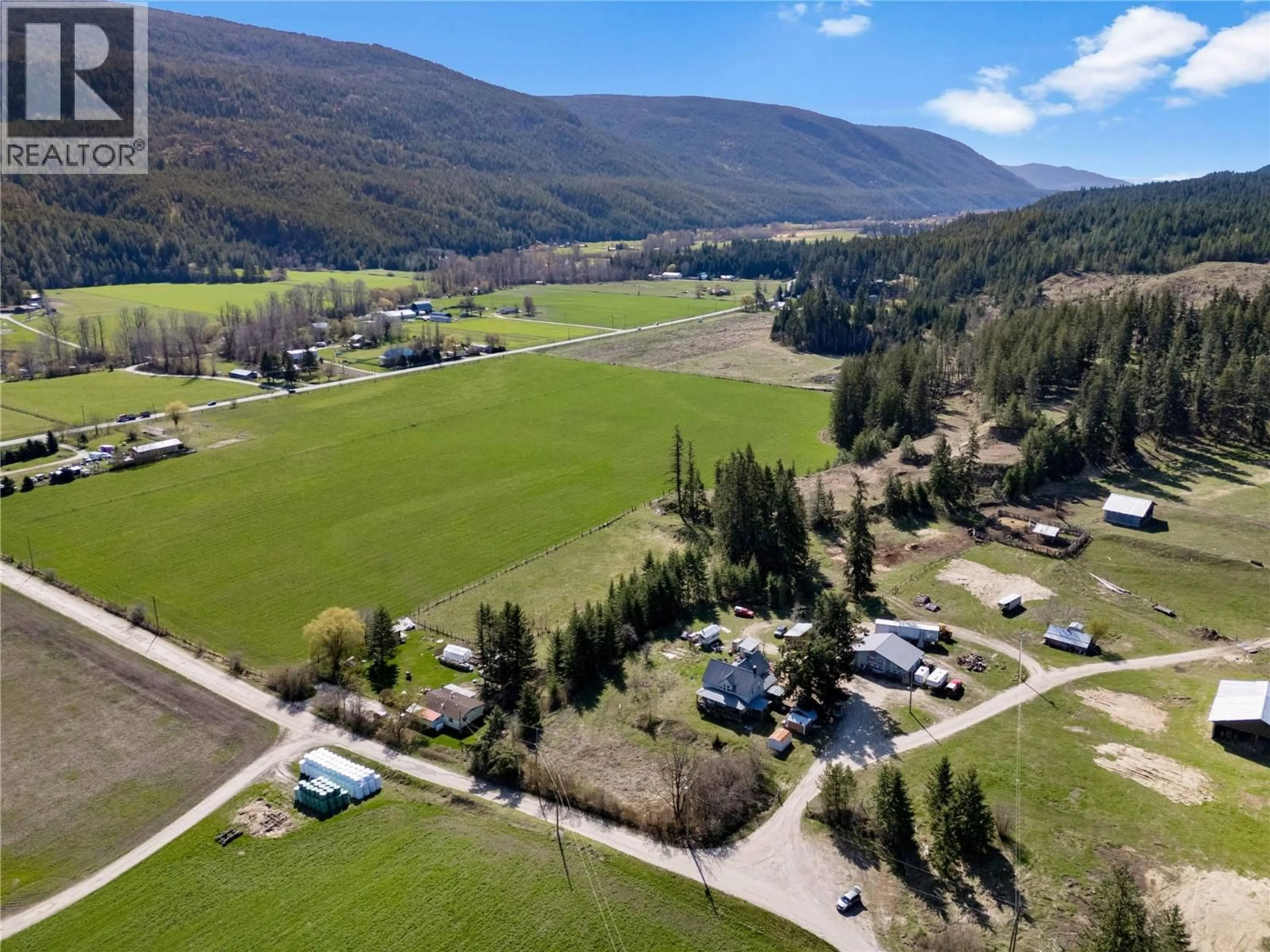 A pic from outside/outdoor area/front of a property/back of a property/a pic from drone, mountain view for 3135 EDES ROAD, Salmon Arm British Columbia V1E3E9
