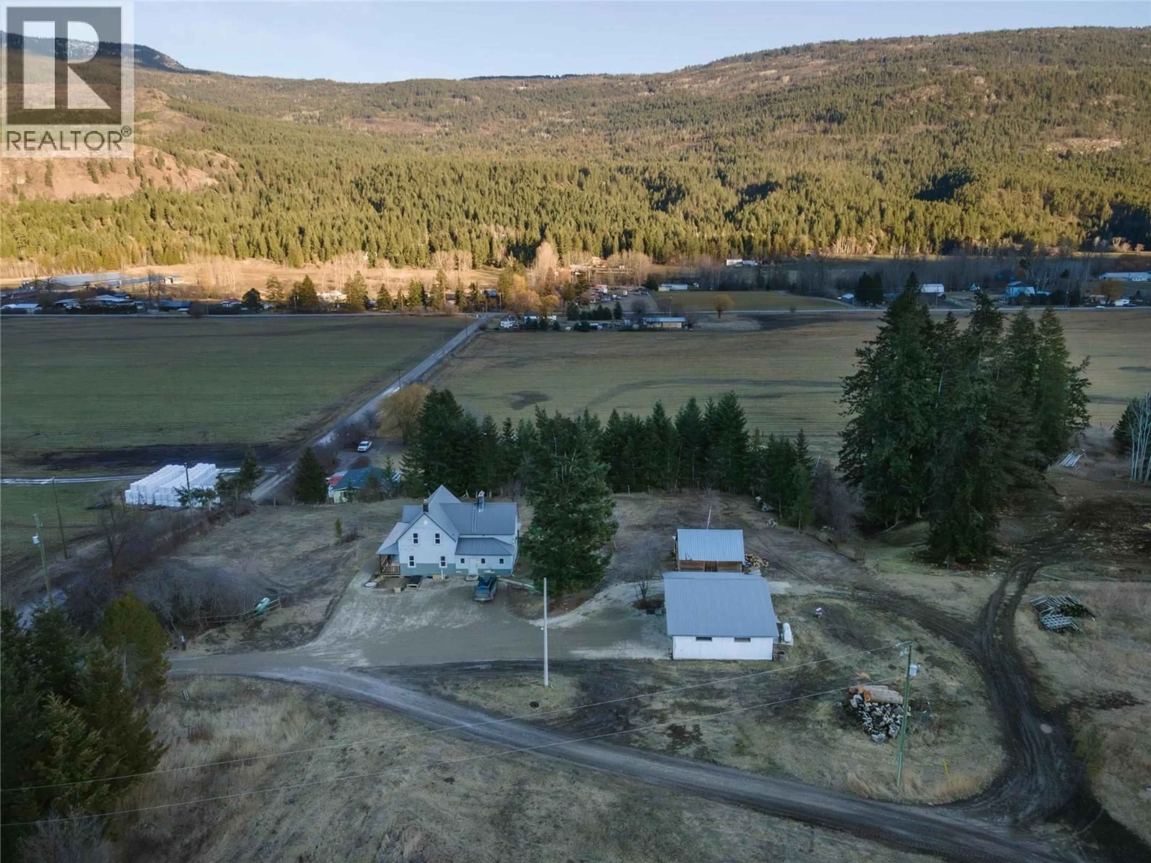 A pic from outside/outdoor area/front of a property/back of a property/a pic from drone, water/lake/river/ocean view for 3135 EDES ROAD, Salmon Arm British Columbia V1E3E9