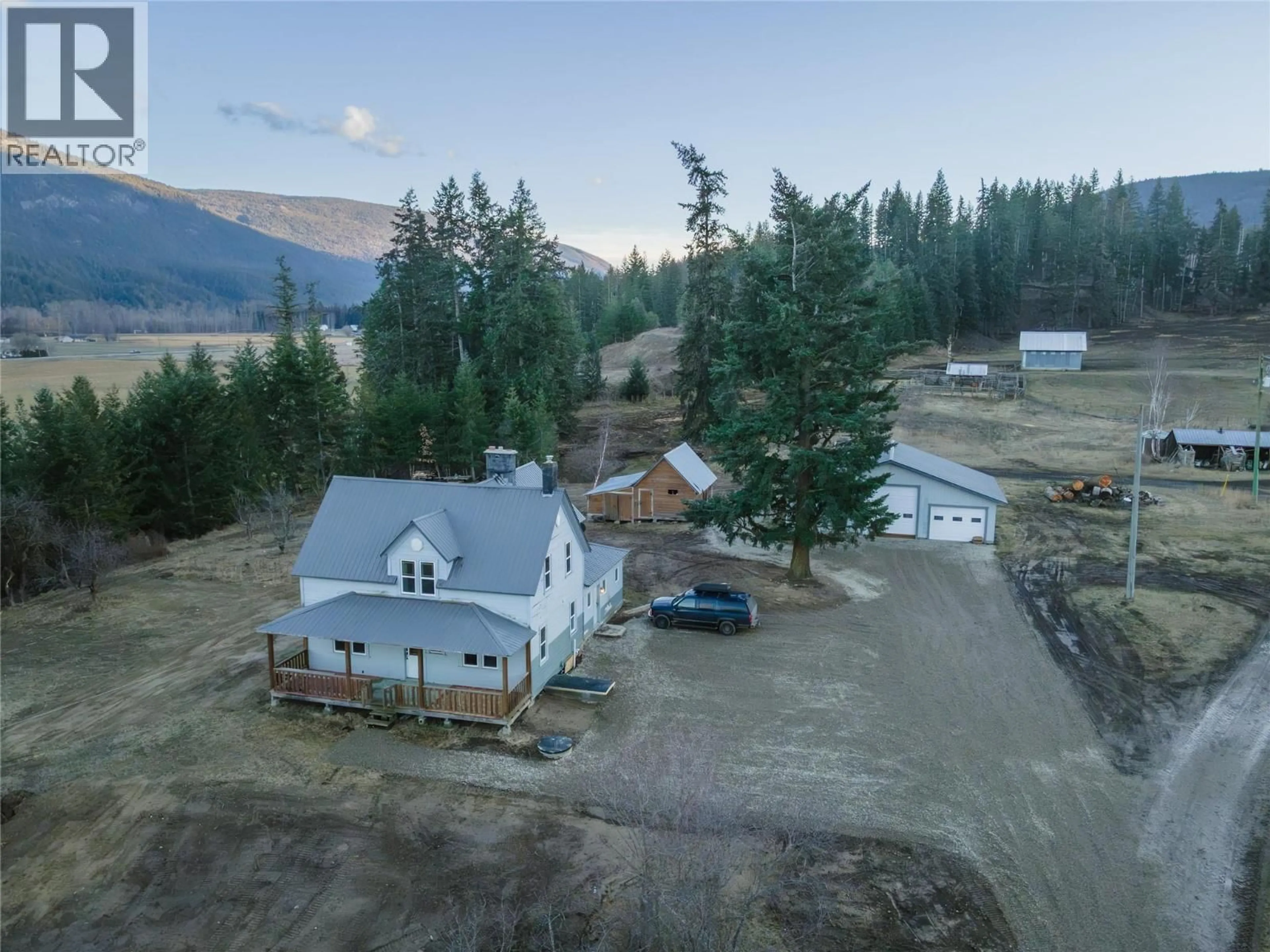 A pic from outside/outdoor area/front of a property/back of a property/a pic from drone, mountain view for 3135 EDES ROAD, Salmon Arm British Columbia V1E3E9