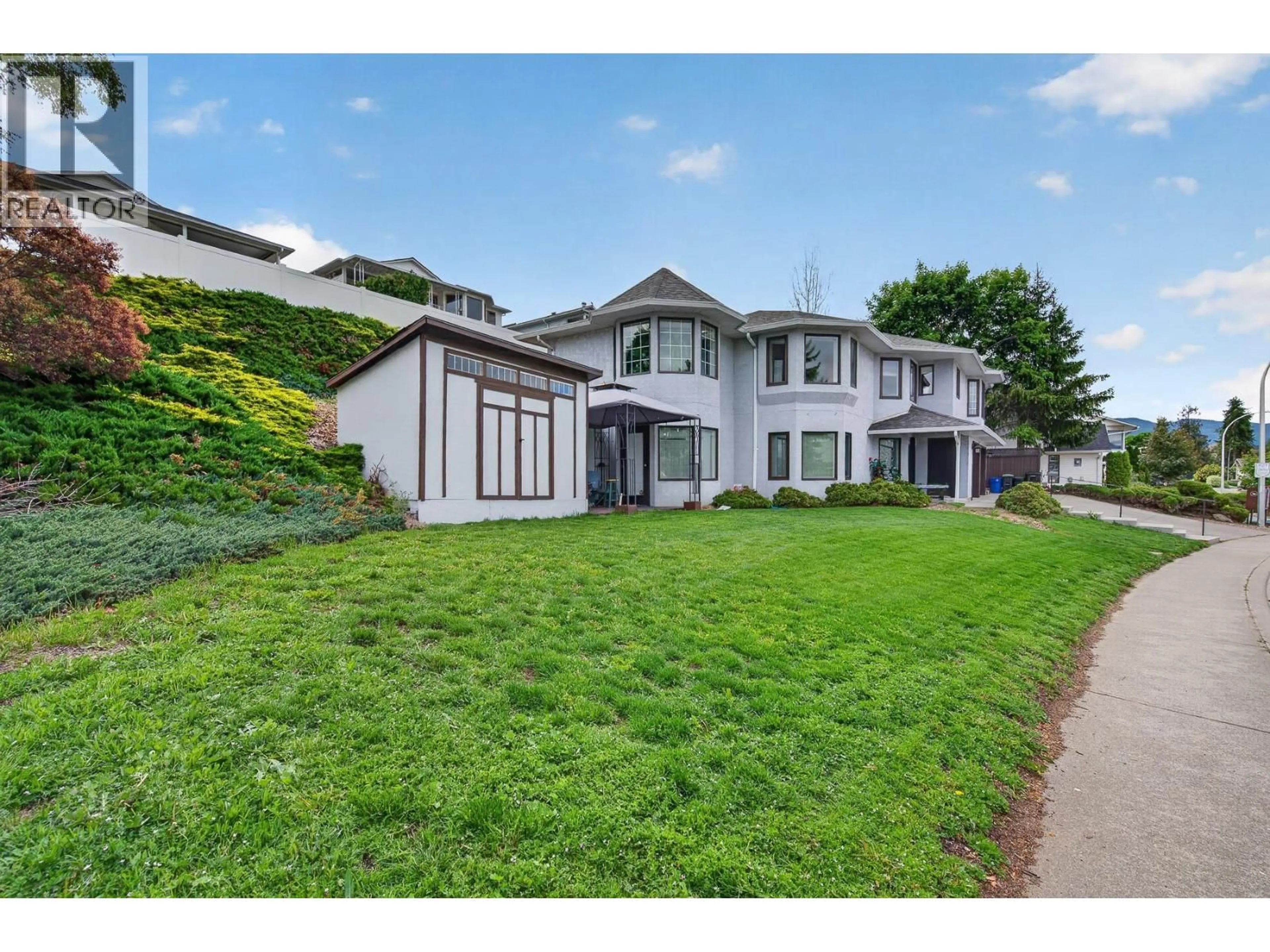 A pic from outside/outdoor area/front of a property/back of a property/a pic from drone, street for 4221 WELLINGTON DRIVE, Vernon British Columbia V1T9H7