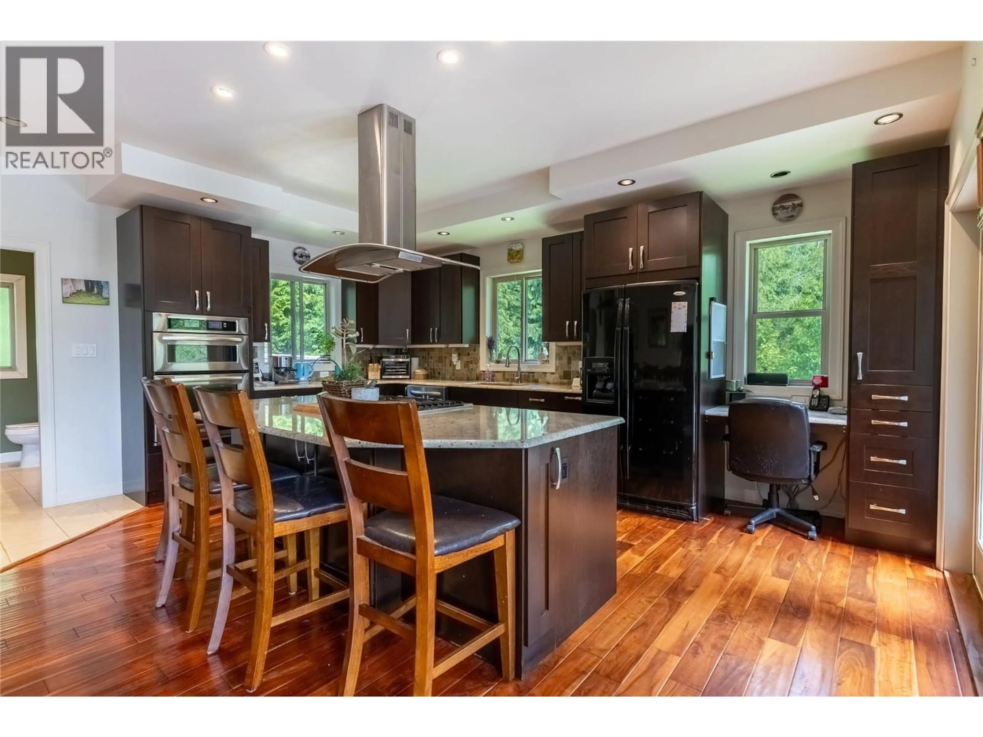 Open concept kitchen, wood/laminate floor for 63 LIBICH ROAD, Salmon Arm British Columbia V1E2Y1